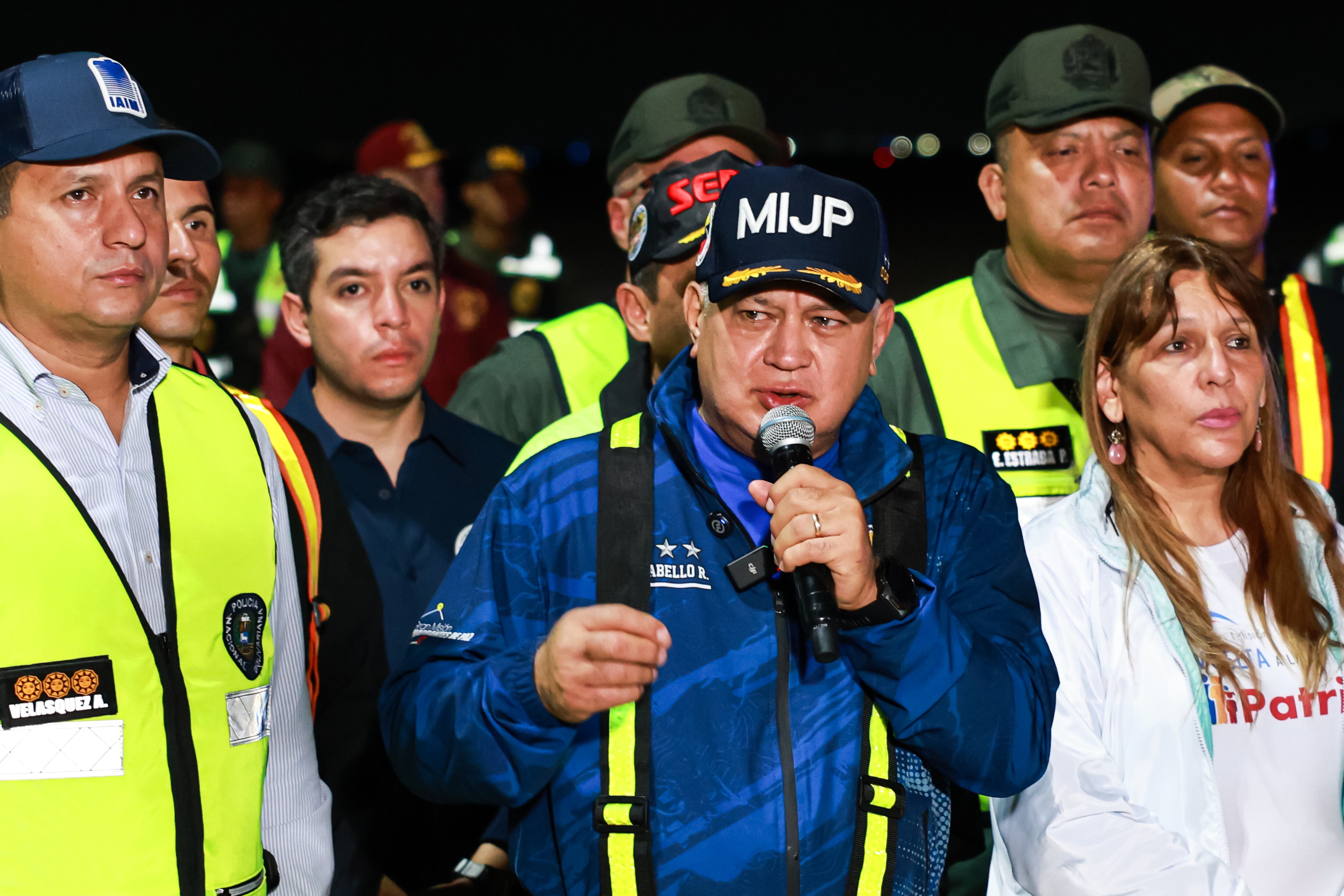 28 March 2025, Venezuela, Maiquetia: Diosdado Cabello (M), Interior Minister of Venezuela, speaks after the arrival of Venezuelans deported from the USA at Simon Bolivar International Airport. The repatriations are part of an agreement signed by the US and Venezuelan governments in January this year. They are also part of the Trump administration's plan to deport millions of migrants who are allegedly in the United States illegally. Photo: Jesus Vargas/dpa (Photo by Jesus Vargas/picture alliance via Getty Images)