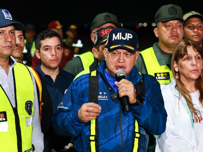 28 March 2025, Venezuela, Maiquetia: Diosdado Cabello (M), Interior Minister of Venezuela, speaks after the arrival of Venezuelans deported from the USA at Simon Bolivar International Airport. The repatriations are part of an agreement signed by the US and Venezuelan governments in January this year. They are also part of the Trump administration's plan to deport millions of migrants who are allegedly in the United States illegally. Photo: Jesus Vargas/dpa (Photo by Jesus Vargas/picture alliance via Getty Images)