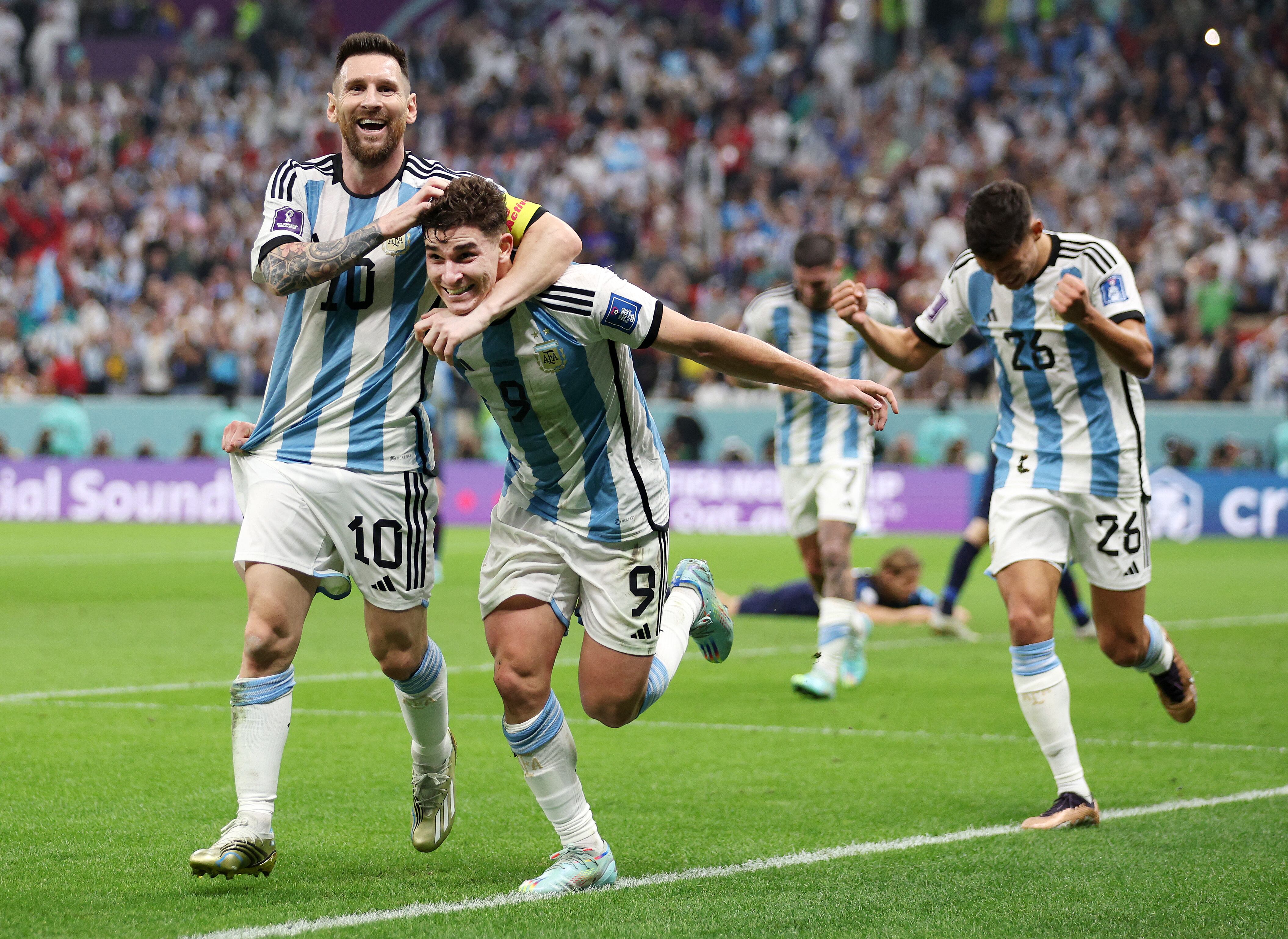 LUSAIL CITY, QATAR - DECEMBER 13: Julian Alvarez of Argentina celebrates with teammate Lionel Messi after scoring their side's second goal during the FIFA World Cup Qatar 2022 semi final match between Argentina and Croatia at Lusail Stadium on December 13, 2022 in Lusail City, Qatar. (Photo by Richard Heathcote/Getty Images)