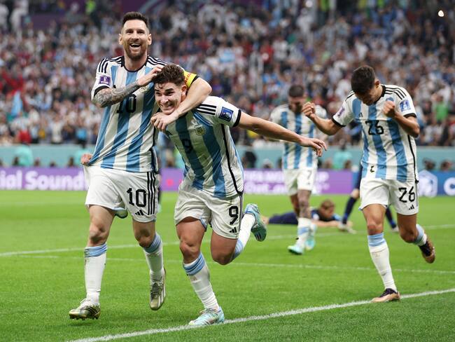 LUSAIL CITY, QATAR - DECEMBER 13: Julian Alvarez of Argentina celebrates with teammate Lionel Messi after scoring their side's second goal during the FIFA World Cup Qatar 2022 semi final match between Argentina and Croatia at Lusail Stadium on December 13, 2022 in Lusail City, Qatar. (Photo by Richard Heathcote/Getty Images)
