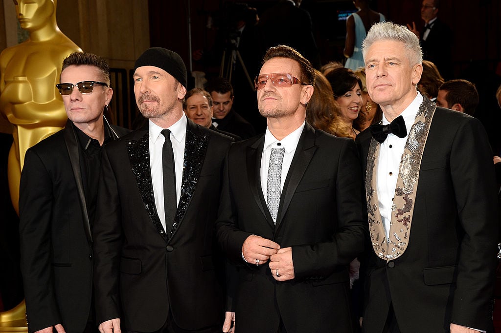 HOLLYWOOD, CA - MARCH 02:  (L-R) Musicians Larry Mullen Jr., The Edge, Bono and Adam Clayton of U2 attend the Oscars held at Hollywood & Highland Center on March 2, 2014 in Hollywood, California.  (Photo by Ethan Miller/WireImage)