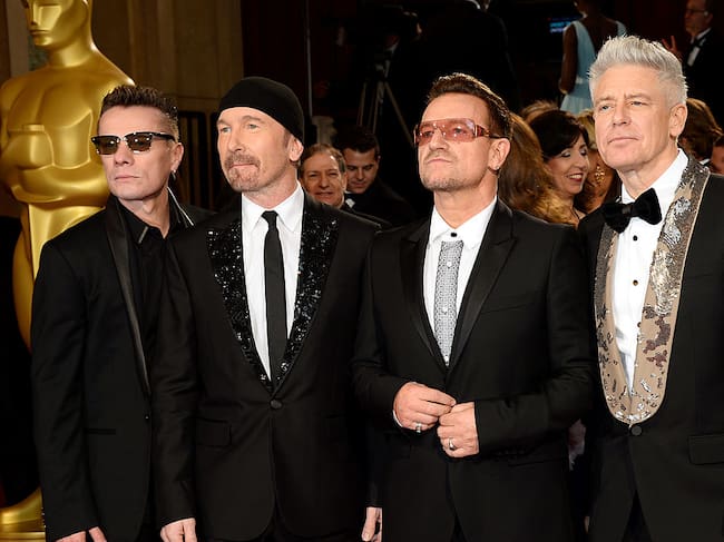 HOLLYWOOD, CA - MARCH 02: (L-R) Musicians Larry Mullen Jr., The Edge, Bono and Adam Clayton of U2 attend the Oscars held at Hollywood & Highland Center on March 2, 2014 in Hollywood, California. (Photo by Ethan Miller/WireImage)