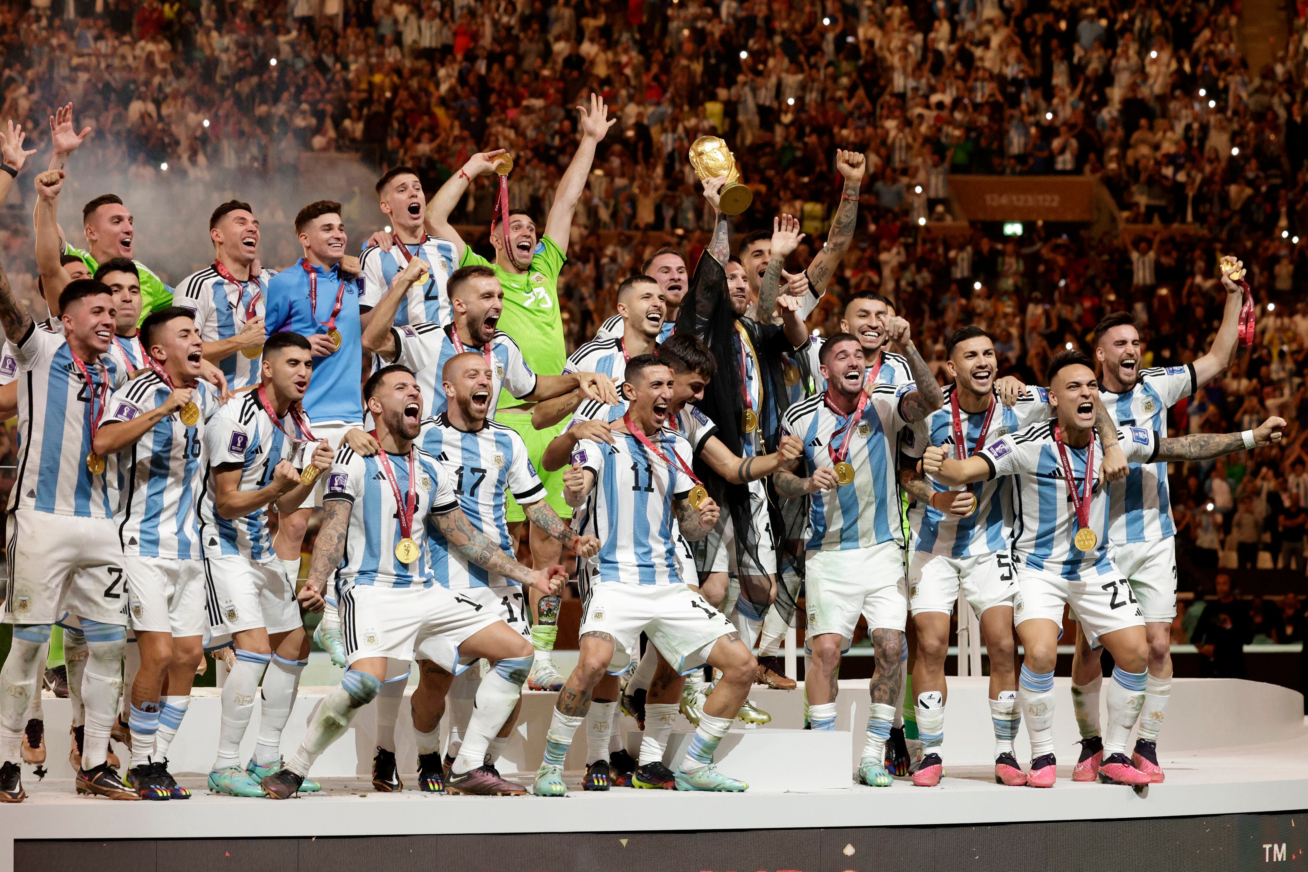 LUSAIL CITY, QATAR - DECEMBER 18: Lionel Messi of Argentina and team celebrate after winning the FIFA World Cup Qatar 2022 Final match between Argentina and France at Lusail Stadium on December 18, 2022 in Lusail City, Qatar. (Photo by Richard Sellers/Getty Images)