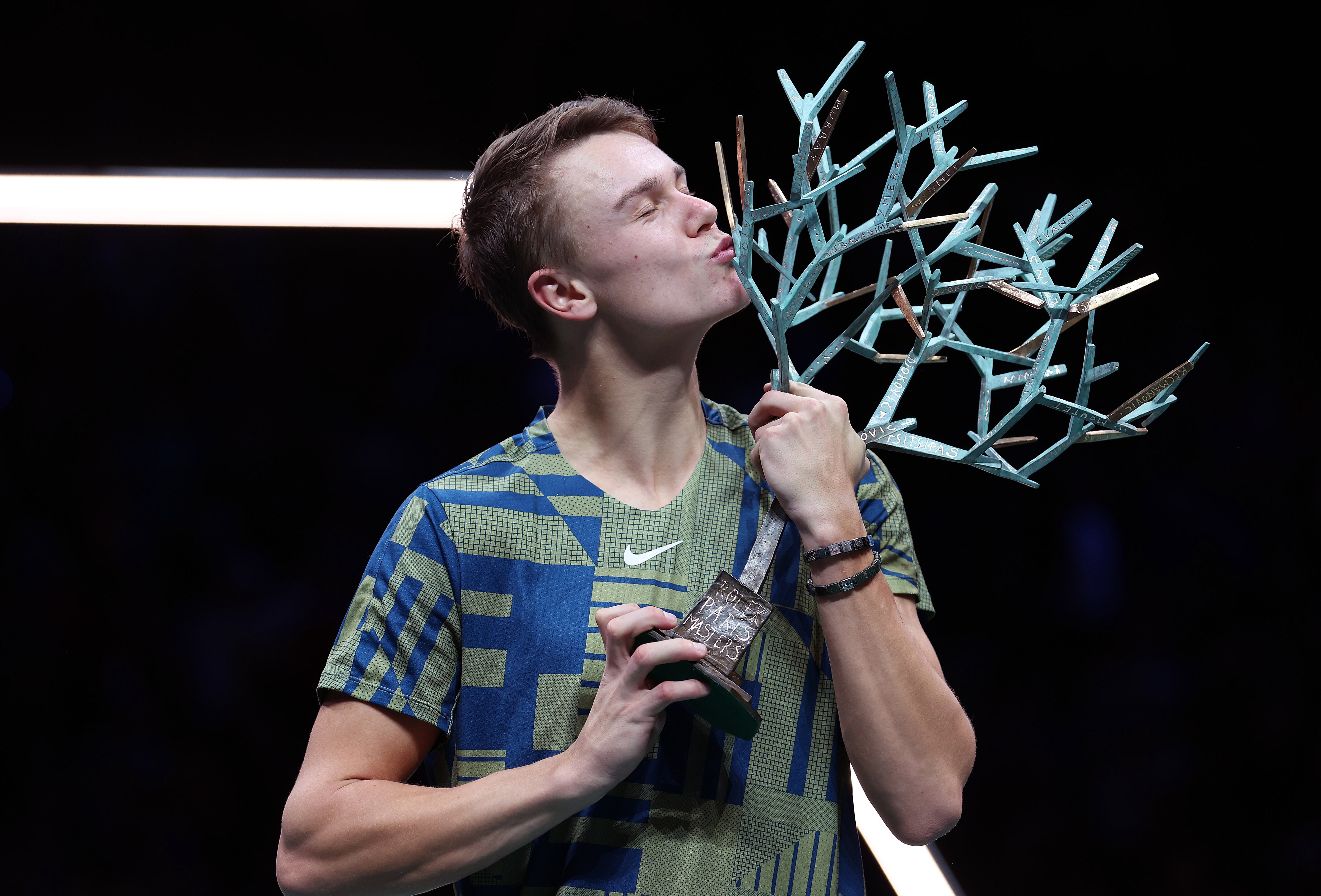 PARIS, FRANCE - NOVEMBER 06:  Holger Rune or Denmark celebrates with the winners trophy after defeating Novak Djokovic of Serbia in the final during Day Seven of the Rolex Paris Masters tennis at Palais Omnisports de Bercy on November 6, 2022 in Paris, France. (Photo by Julian Finney/Getty Images)