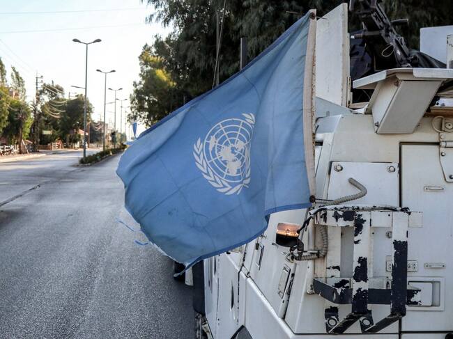 A United Nations flag flies in the back of one of the armoured vehicles of the UN Interim Force in Lebanon (UNIFIL) during a patrol around Marjayoun in south Lebanon on October 8, 2024. (Photo by AFP)