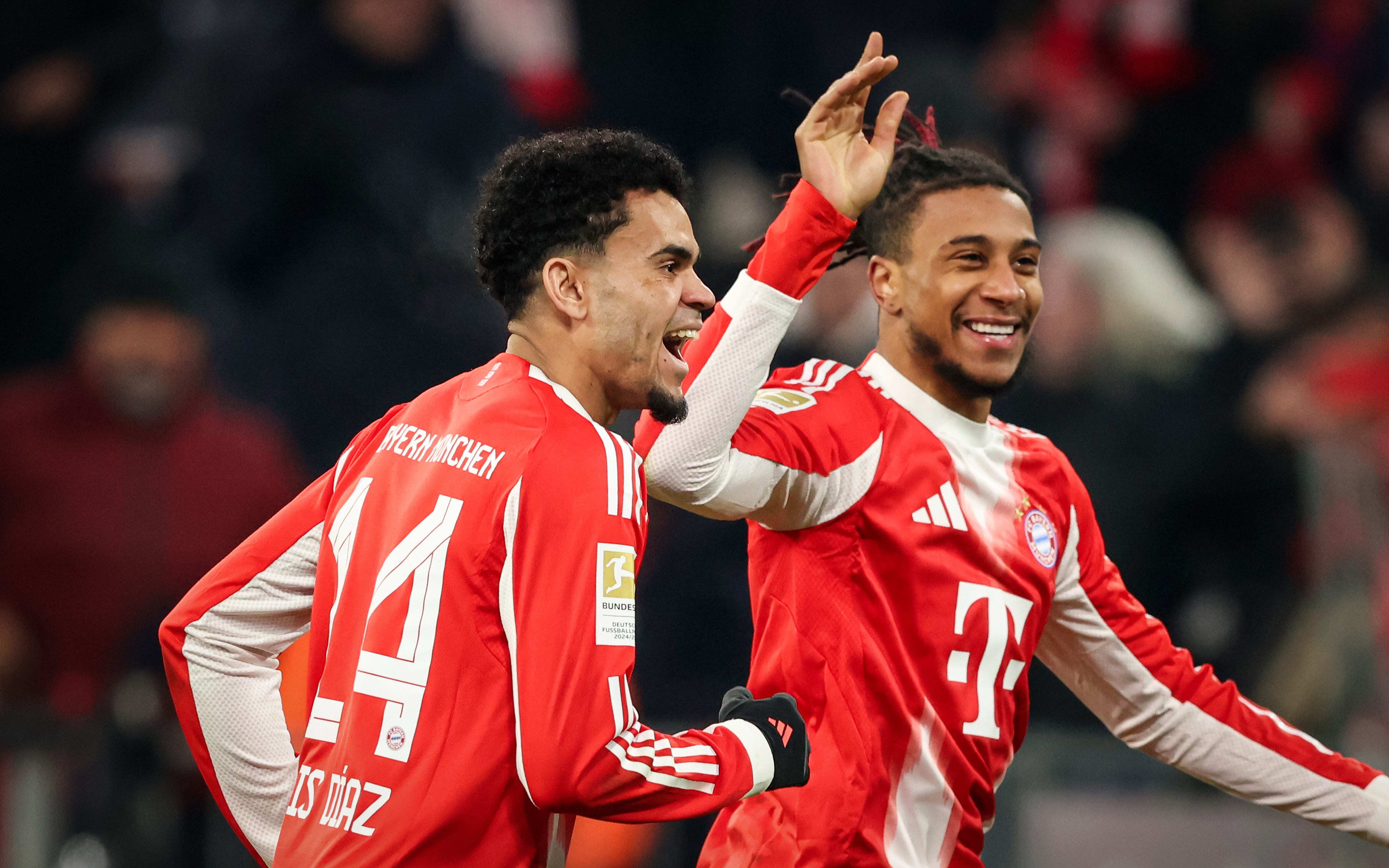 MUNICH, GERMANY - JANUARY 11: Michael Olise of Bayern Muenchen celebrates as he scores the goal 3:1 with Luis Diaz of Bayern Muenchen during the Bundesliga match between FC Bayern München and VfL Wolfsburg at Allianz Arena on January 11, 2026 in Munich, Germany. (Photo by Stefan Matzke - sampics/Getty Images)