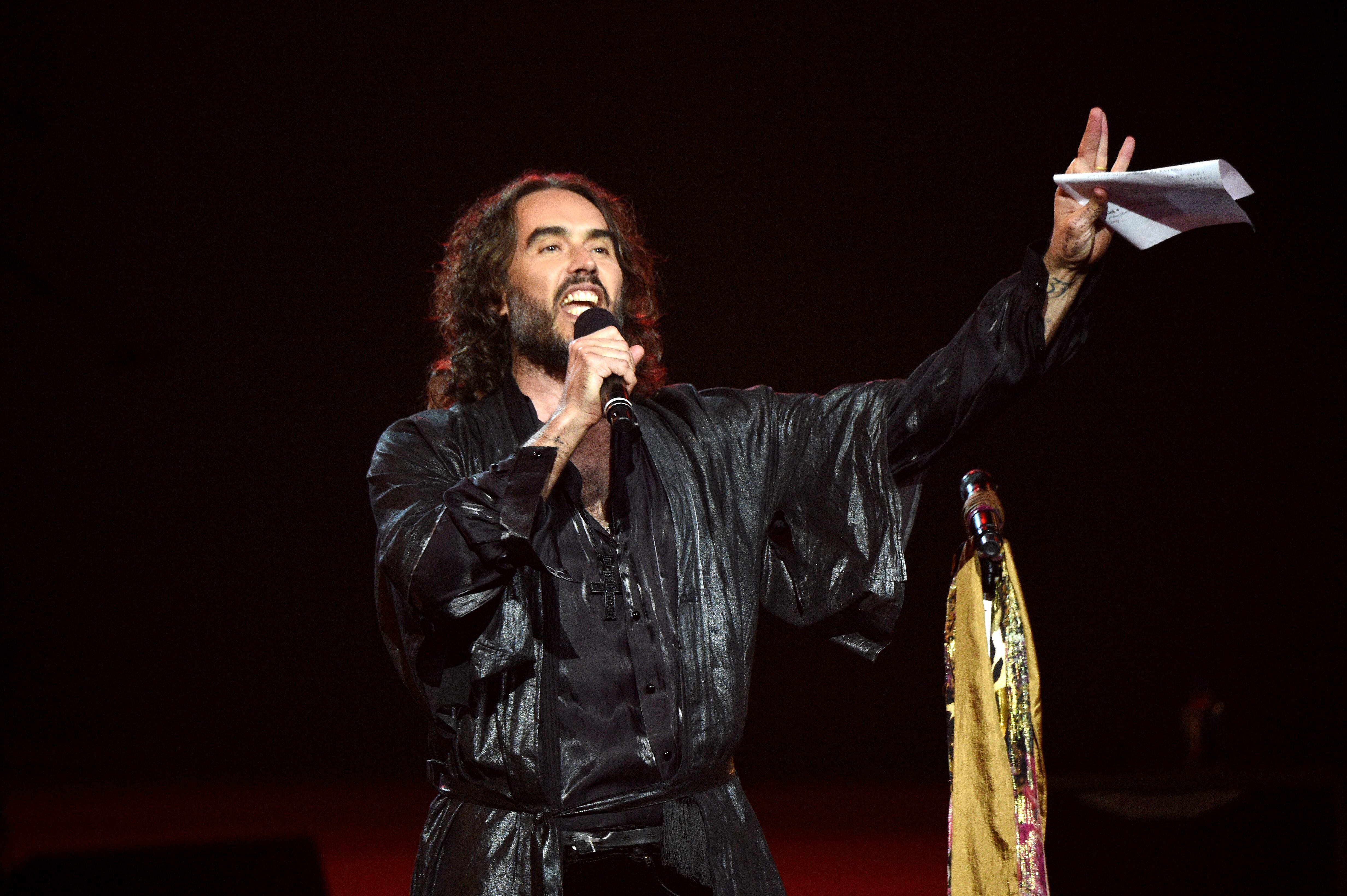 LOS ANGELES, CALIFORNIA - JANUARY 24: Russell Brand speaks onstage during MusiCares Person of the Year honoring Aerosmith at West Hall at Los Angeles Convention Center on January 24, 2020 in Los Angeles, California. (Photo by Kevin Mazur/Getty Images for The Recording Academy)