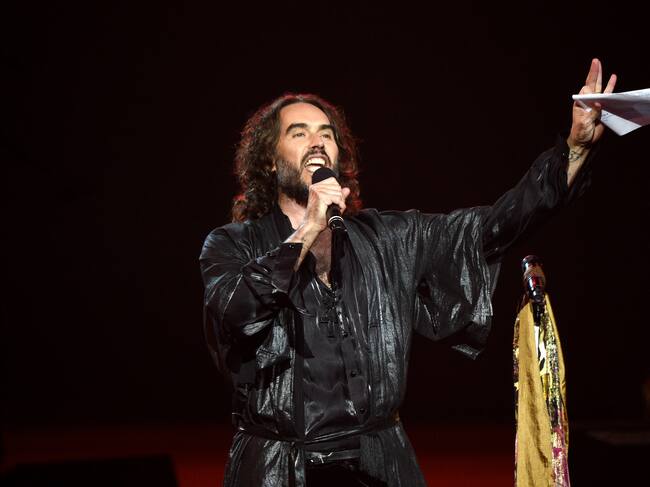 LOS ANGELES, CALIFORNIA - JANUARY 24: Russell Brand speaks onstage during MusiCares Person of the Year honoring Aerosmith at West Hall at Los Angeles Convention Center on January 24, 2020 in Los Angeles, California. (Photo by Kevin Mazur/Getty Images for The Recording Academy)