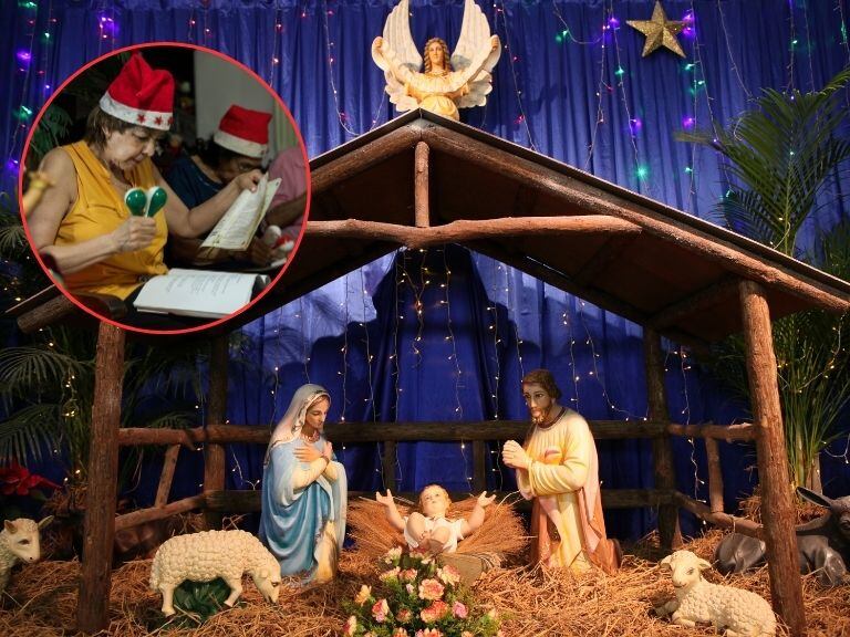 Imagen de referencia sobre el pesebre y personas haciendo la Novena de Navidad. / Getty Images