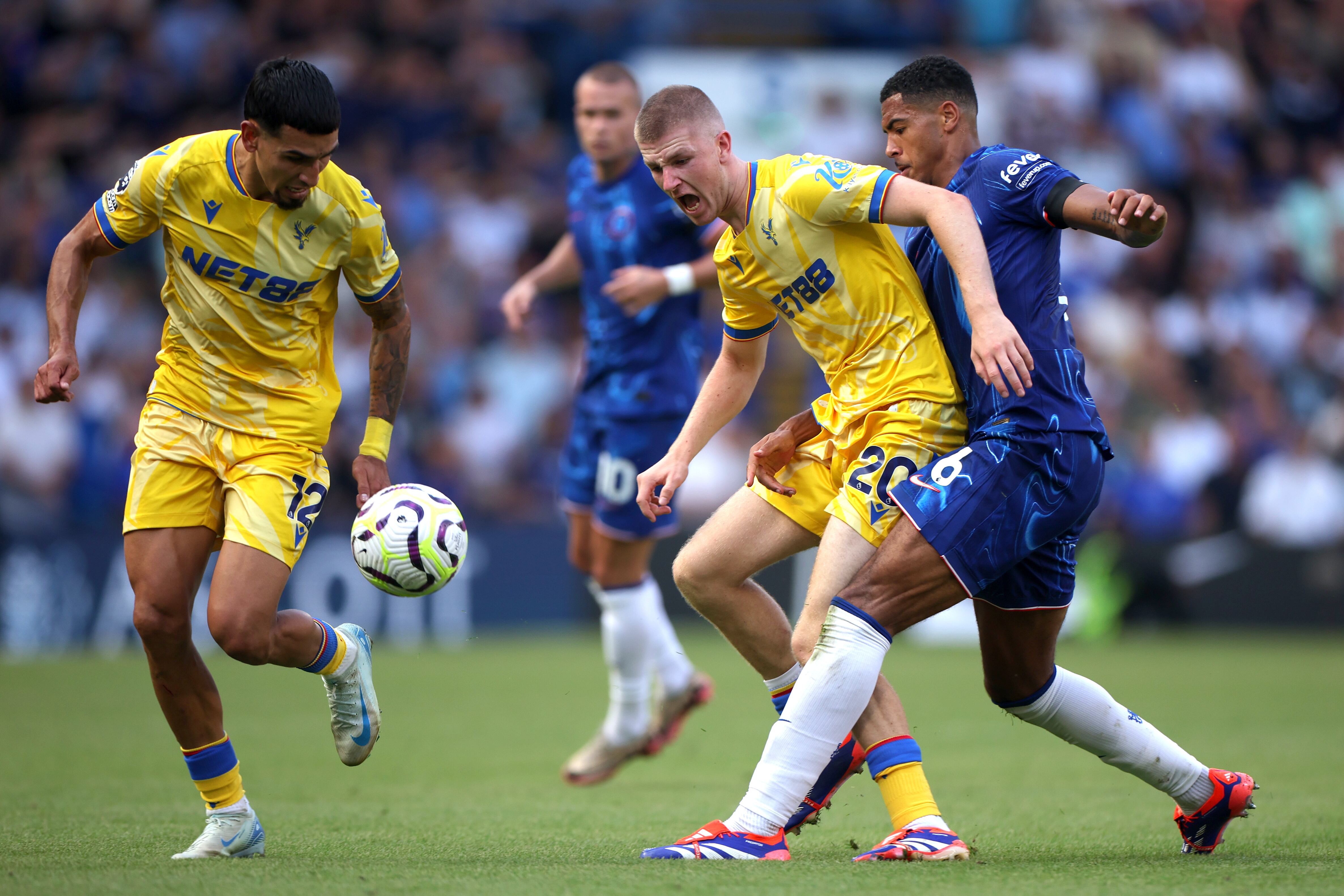 LONDON, ENGLAND - SEPTEMBER 01: Adam Wharton of Crystal Palace is tackled by Levi Colwill of Chelsea during the Premier League match between Chelsea FC and Crystal Palace FC at Stamford Bridge on September 01, 2024 in London, England. (Photo by Alex Pantling/Getty Images)