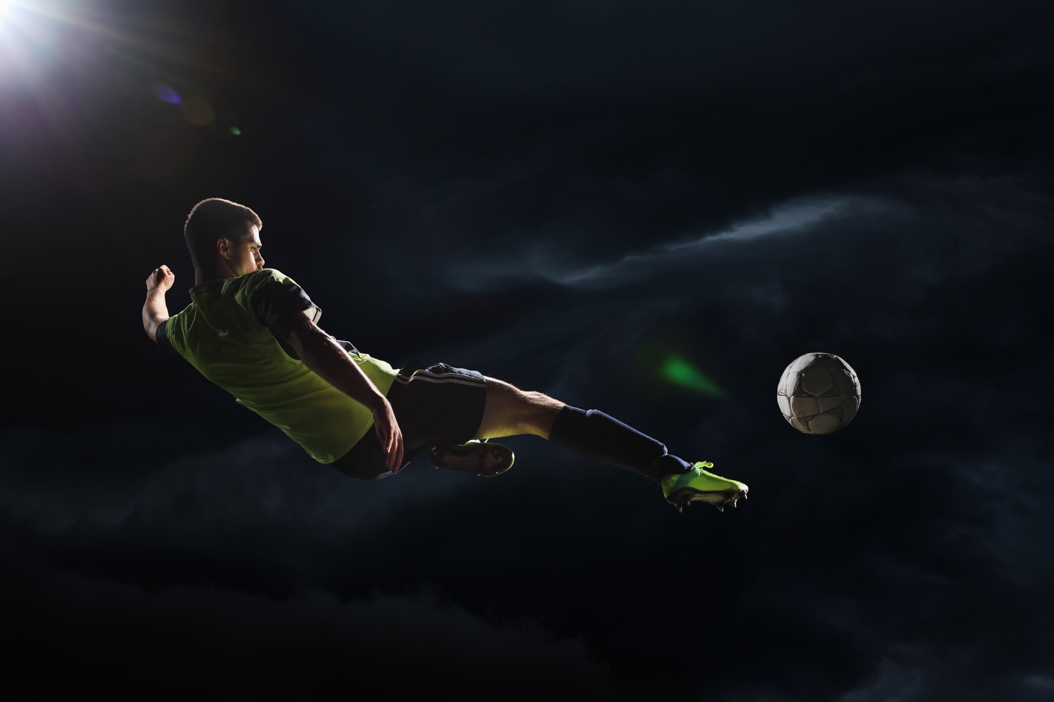 Soccer player kicking the ball