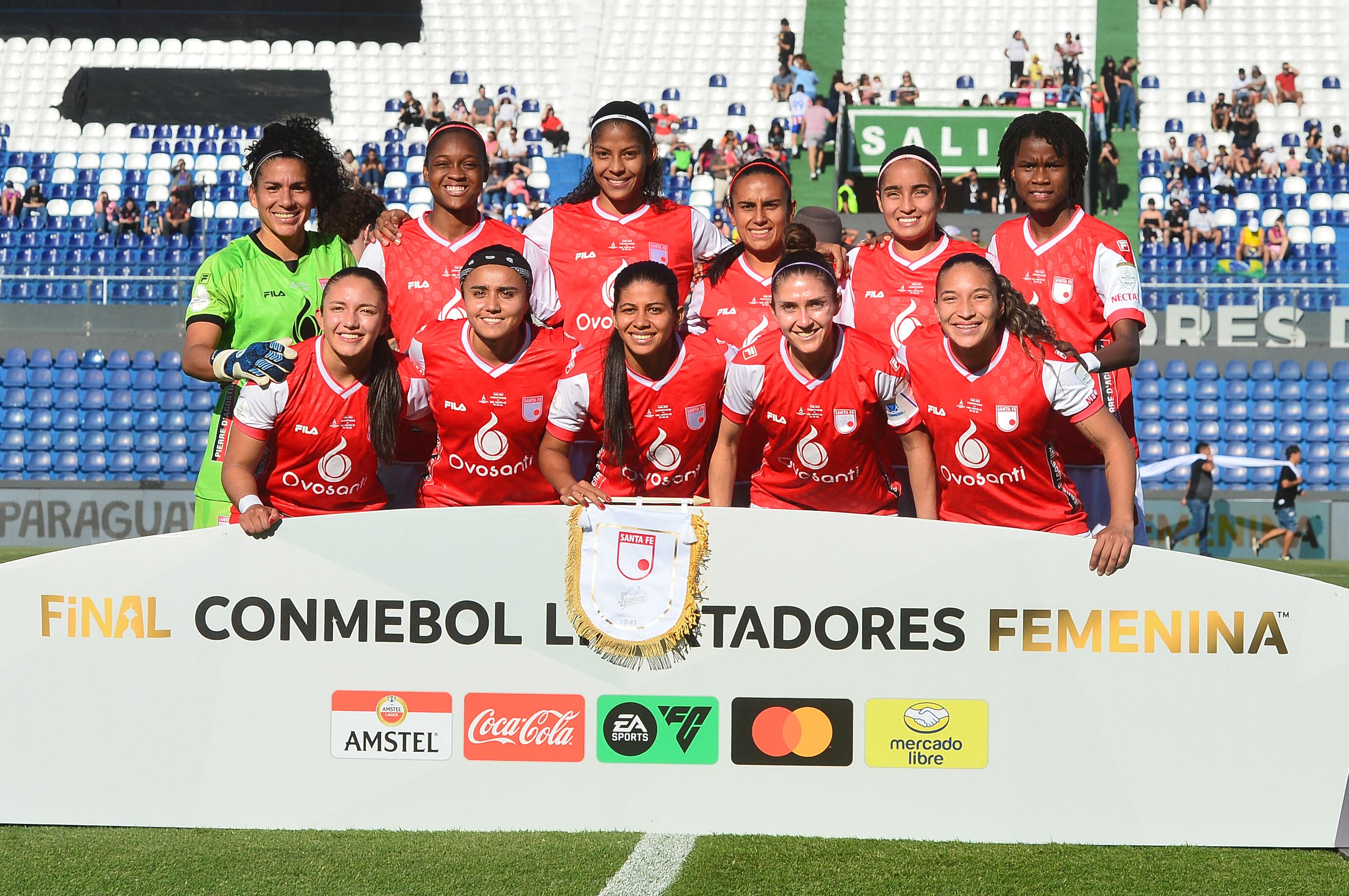 Players of Independiente Santa Fe pose for a picture before the 2024 Women Copa Libertadores final match between Brazil's Corinthians and Colombia's Independiente Santa Fe at Defensores del Chaco stadium in Asuncion on October 19, 2024. (Photo by Daniel Duarte / AFP) (Photo by DANIEL DUARTE/AFP via Getty Images)
