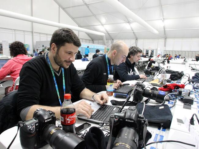 Photographers working in the Cypress Media Centre on Thursday, Feb. 25, 2010, during the Vancouver 2010 Olympic Winter Games. AFP PHOTO / STEPHANIE LAMY (Photo credit should read STEPHANIE LAMY/AFP via Getty Images)