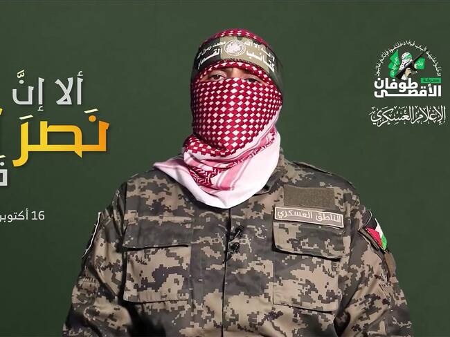 An image grab from a video released by the media office of the Palestinian Hamas movement in Gaza on its official Telegaram channel on October 16, 2023 shows Abu Obeida -- spokesman for Hamas's military wing, the Ezzedine al-Qassam Brigades -- speaking with his face covered in a televised statement in which he said some foreign hostages would be released by the group "when conditions are ripe". The video, which showed a Franco-Israeli hostage speaking from captivity, is the first to be released by the militant group purportedly showing an Israeli abducted on October 7, when Hamas militants attacked southern Israel, triggering a war that has killed thousands of people in both Israel and the blockaded Gaza Strip. (Photo by HAMAS MEDIA OFFICE / AFP) / RESTRICTED TO EDITORIAL USE - MANDATORY CREDIT "AFP PHOTO / HAMAS MEDIA OFFICE" - NO MARKETING NO ADVERTISING CAMPAIGNS - DISTRIBUTED AS A SERVICE TO CLIENTS --- NO ARCHIVE ---