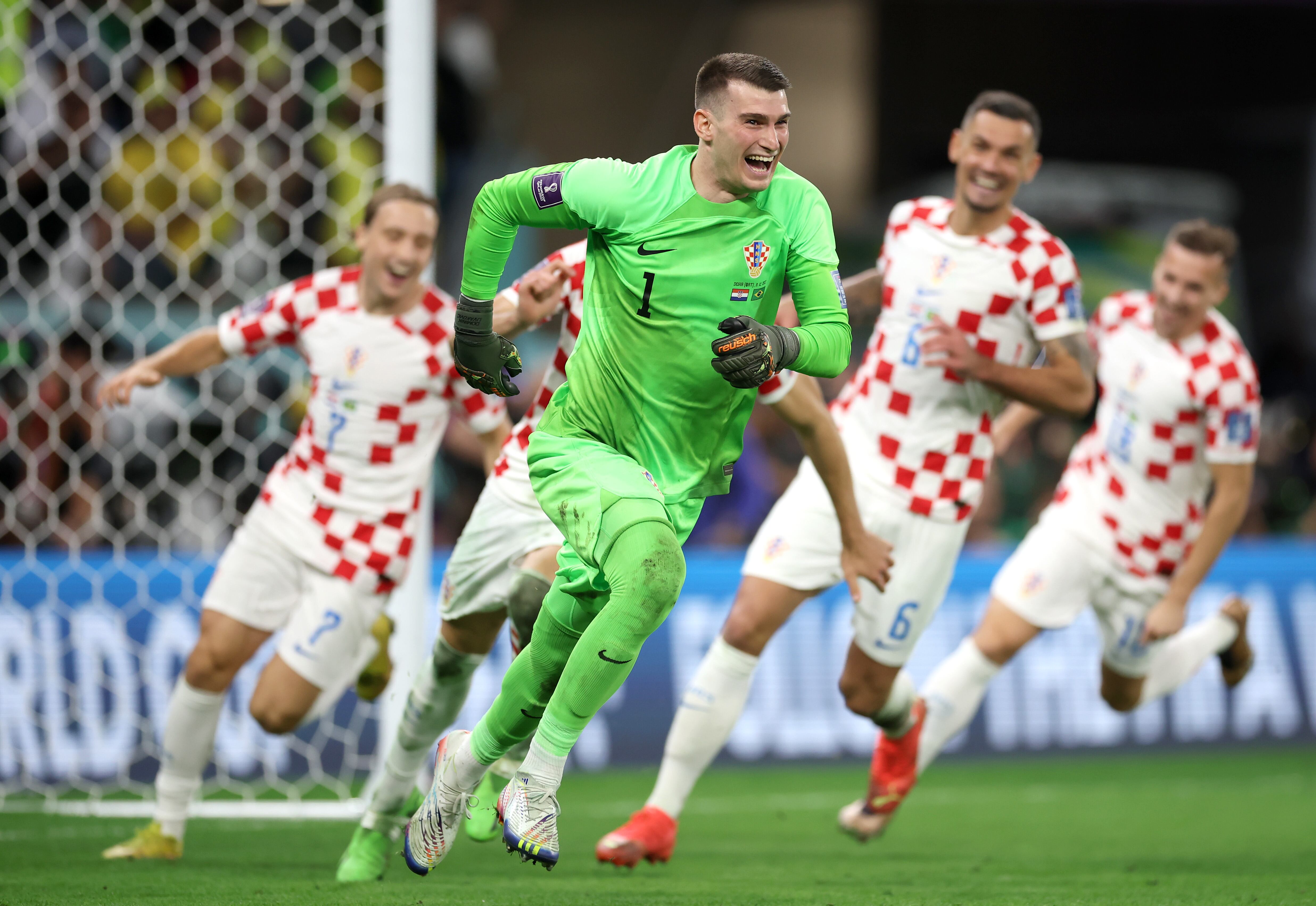 AL RAYYAN, QATAR - DECEMBER 09: Dominik Livakovic of Croatia celebrates the win via a penalty shootout during the FIFA World Cup Qatar 2022 quarter final match between Croatia and Brazil at Education City Stadium on December 09, 2022 in Al Rayyan, Qatar. (Photo by Alex Grimm/Getty Images)