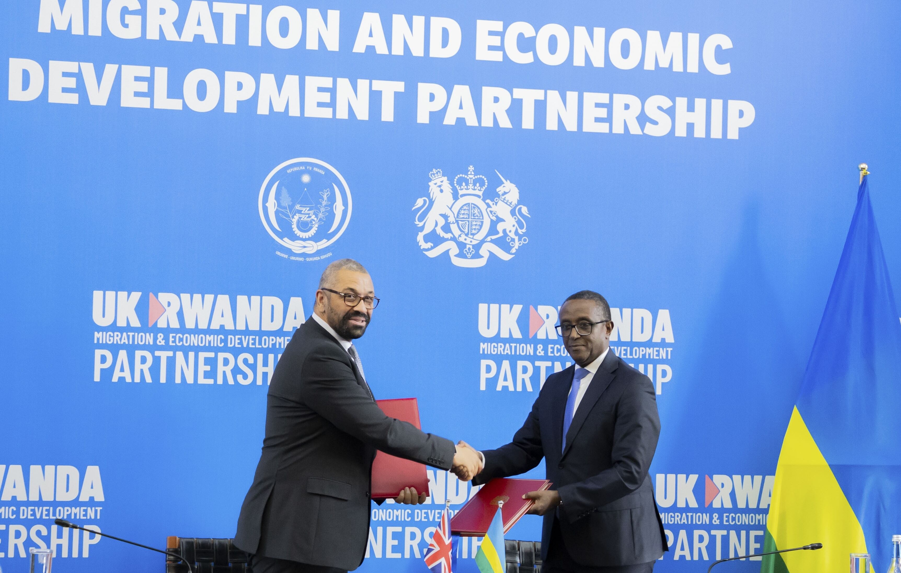 KIGALI, RWANDA - DECEMBER 05: UK Home Secretary James Cleverly and Rwandan Foreign Minister Vincent Biruta sign a new deal on a reworked asylum scheme in Kigali, Rwanda on December 05, 2023. (Photo by Cyrile Ndegeya/Anadolu via Getty Images)