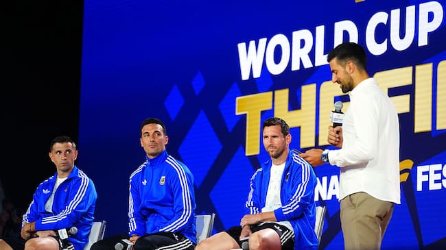 NEW YORK, UNITED STATES - JULY 17: Emiliano Martinez, Lionel Messi and Lionel Scaloni, head coach of Argentina, are seen as Serbian tennis player Novak Djokovic (R) speaks during a press conference ahead of the FIFA World Cup 2026 Final match between Spain and Argentina at Fanatics Fest at Javits Center in New York, United States on July 17, 2026. (Photo by Evrim Aydin/Anadolu via Getty Images)