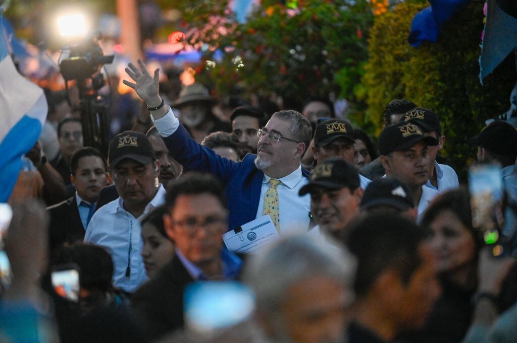 Guatemalan President-elect Bernardo Arevalo (C) waves to his supporters during a protest to demand the resignation of Attorney General Consuelo Porras and prosecutor Rafael Curruchiche in Guatemala City on September 18, 2023. Arevalo presented this Monday at the Supreme Court headquarters a request for the removal of Attorney General Consuelo Porras, whom he accuses of orchestrating a "coup d'état" to prevent him from assuming power in January. (Photo by Johan ORDONEZ / AFP) (Photo by JOHAN ORDONEZ/AFP via Getty Images)