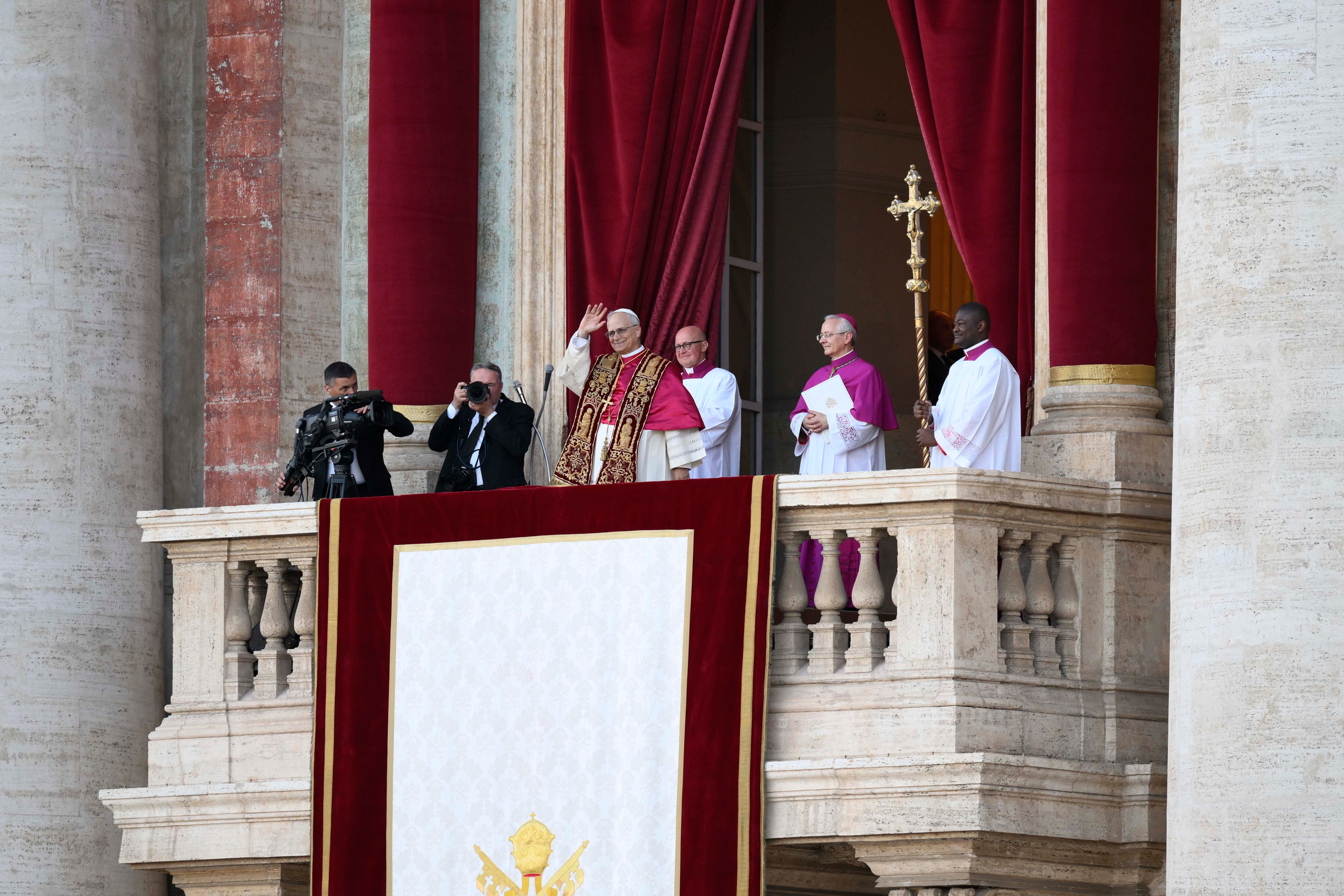 VATICAN CITY, VATICAN - MAY 08: (EDITOR NOTE: STRICTLY EDITORIAL USE ONLY - NO MERCHANDISING). Newly elected Pope Leo XIV, Robert Prevost addresses the crowd on the main central loggia balcony overlooking St Peter's Square on May 08, 2025 in Vatican City, Vatican. White smoke was seen over the Vatican early this evening as the Conclave of Cardinals took just two days to elect Cardinal Robert Francis Prevost, who will be known as Pope Leo  (Leone)  XIV, as the 267th Supreme Pontiff after the death of Pope Francis on Easter Monday. (Photo by Vatican Media via Vatican Pool/Getty Images)