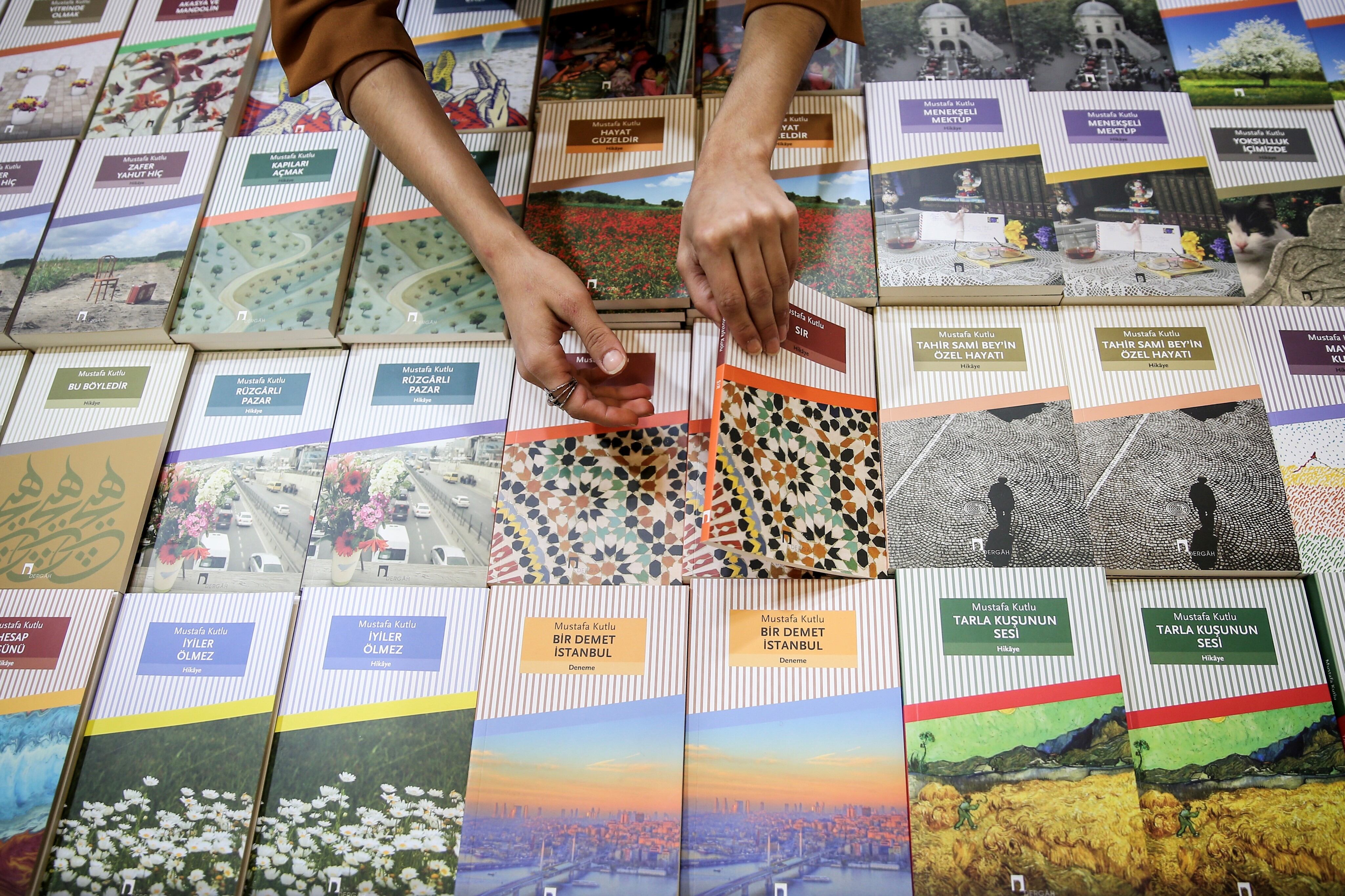 ISTANBUL, TURKEY - NOVEMBER 14: Visitors look at books as they visit the 37th International Istanbul Book Fair held in Istanbul, Turkey on November 14, 2018. Organized by TUYAP Fairs in partnership with the Turkish Publishers Association, the fair opened with the theme "Surrounding Life with Literature". Anadolu Agency -- who is a global communication partner of the Book Fair -- has also set up a stall at the fair. (Photo by Ahmet Bolat/Anadolu Agency/Getty Images)