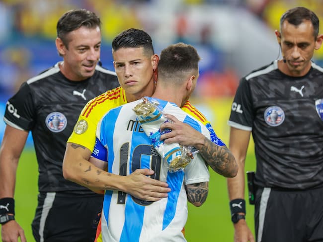 MIAMI GARDENS, FLORIDA - JULY 14: James Rodriguez #10 of Colombia and Lionel Messi #10 of Argentina hug before the match between Colombia and Argentina at Hard Rock Stadium on July 14, 2024 in Miami Gardens, FL. (Photo by Roger Wimmer/ISI Photos/Getty Images)