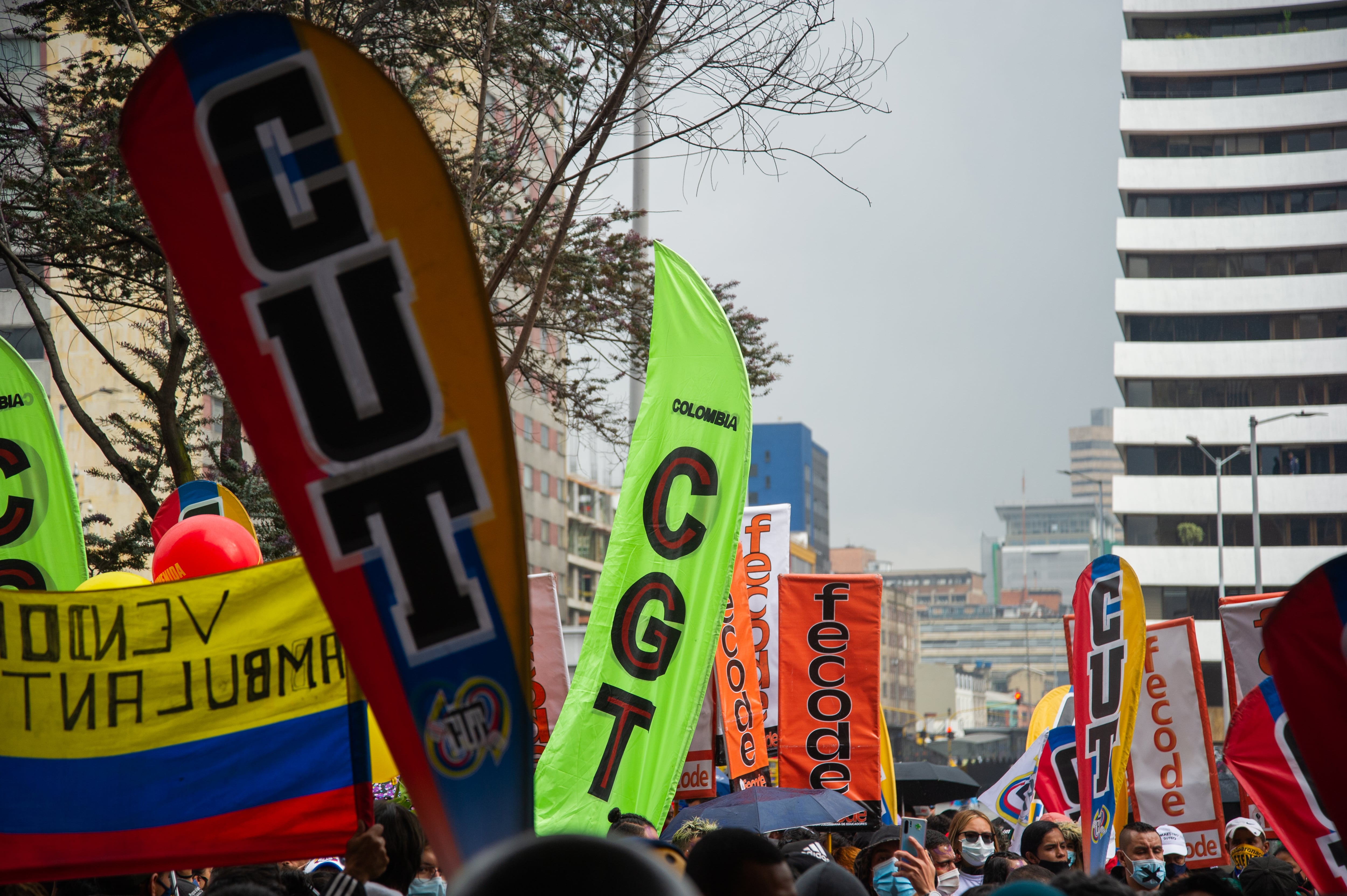 Banners of the national strike organizers "CUT" "CGT" AND Fecode are seen as anti-government demonstrations in front of the Tequendama Hotel took place during meetings with CIDH and United Nations Human Rights watchers and representatives of the protests, in Bogota, Colombia on June 9, 2021. (Photo by Sebastian Barros/NurPhoto via Getty Images)