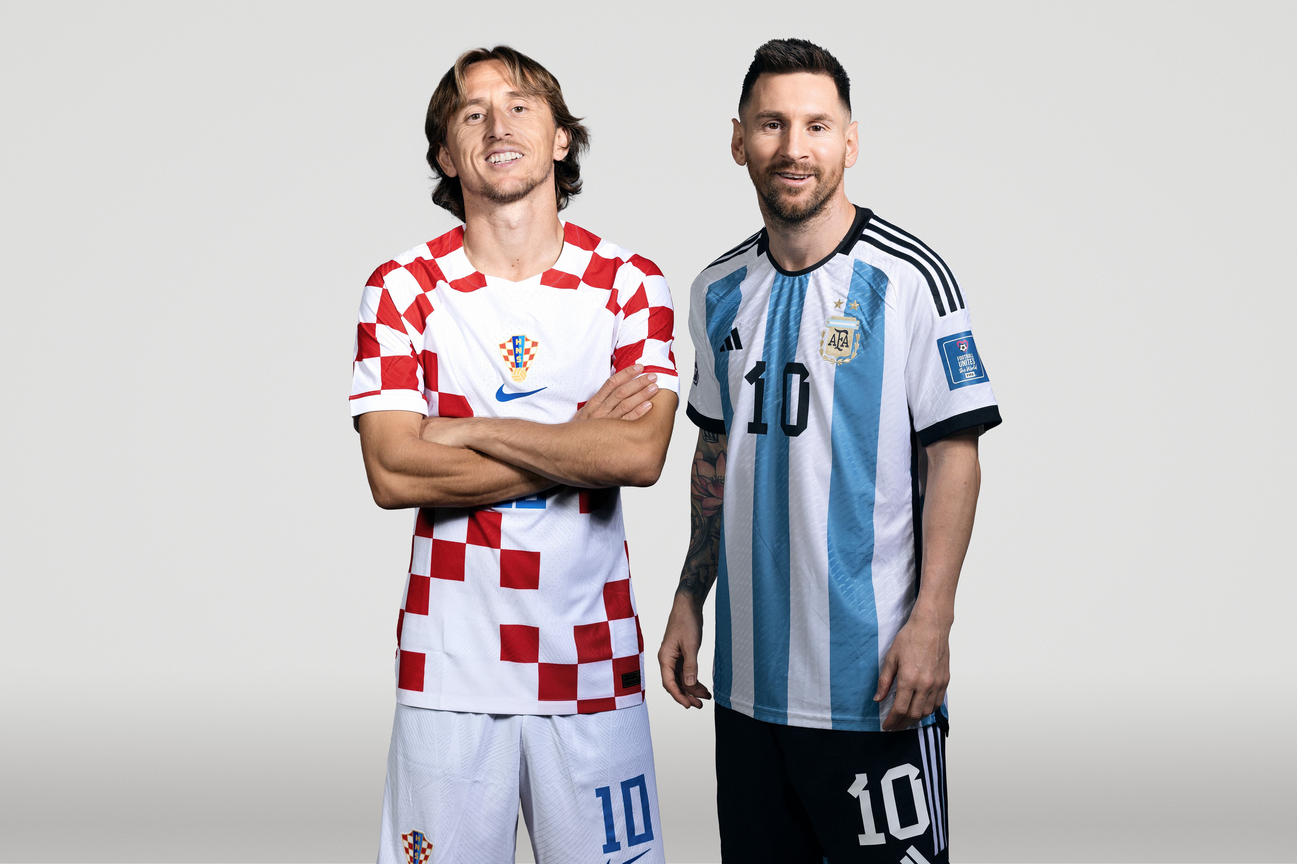(EDITORS NOTE: THIS IMAGE HAS BEEN RETOUCHED) In this composite image, a comparison has been made between (L-R) Luka Modric of Croatia and Lionel Messi of Argentina, who are posing during the official FIFA World Cup 2022 portrait sessions. Argentina and Croatia meet in one of the semi finals of the FIFA World Cup Qatar 2022. (Photo by FIFA/FIFA via Getty Images)