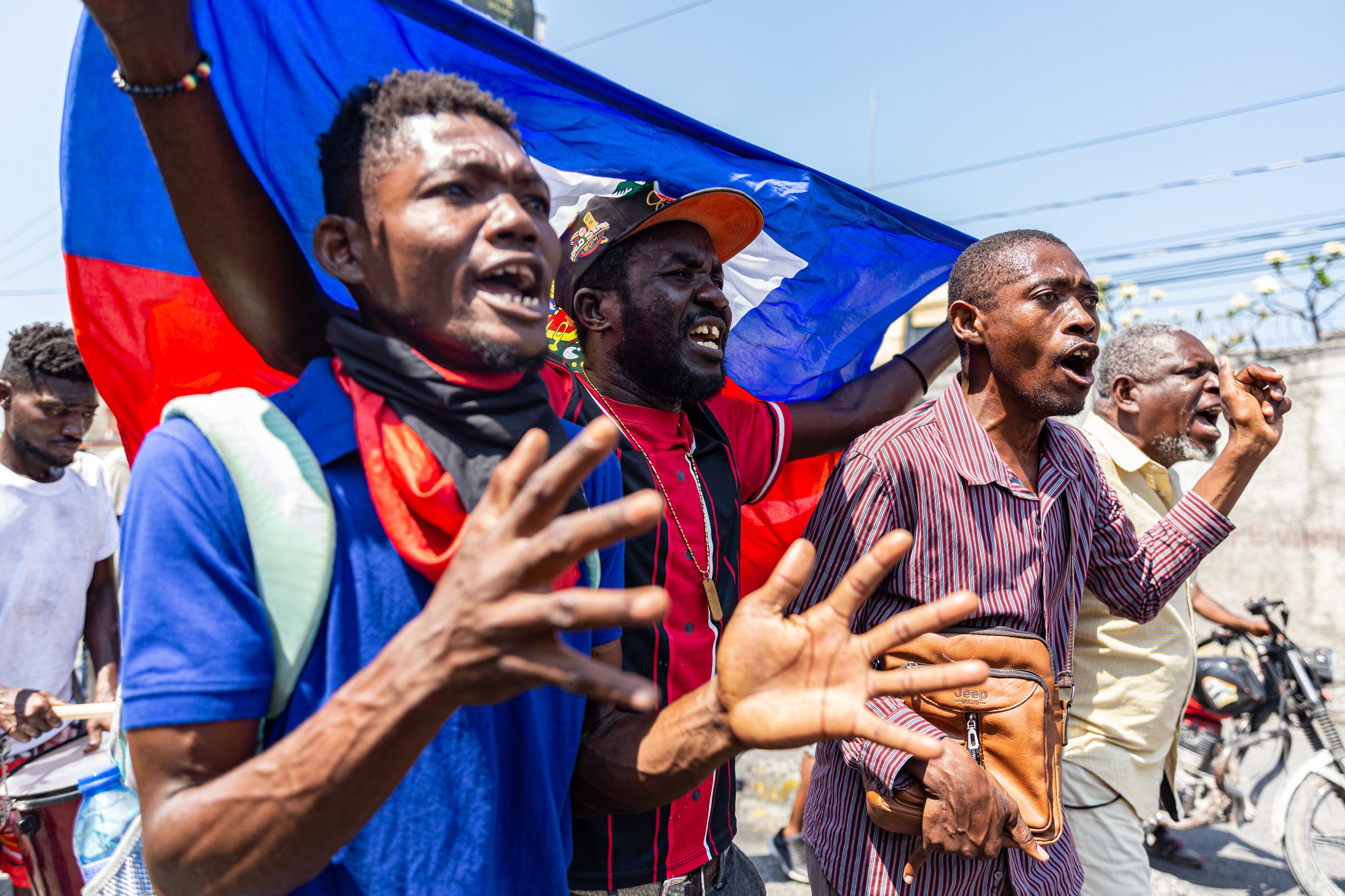 PORT-AU-PRINCE, HAITI- MARCH 12: Some people reacted during a demonstration against CARICOM for the decision following the resignation of Haitian Prime Minister Ariel Henry as representatives of the Caribbean Community (CARICOM) and Haitian actors made an agreement for political transition in Haiti it a historic decision that was made by the formation of a seven-member Presidential Council (CP), and the Haitian government on Tuesday extended the night-time curfew and state of emergency in the capital of Port-au-Prince for a month amid a wave of violence triggered by armed groups in Port-au-Prince, Haiti, on March 12, 2024. (Photo by Guerinault Louis/Anadolu via Getty Images)
