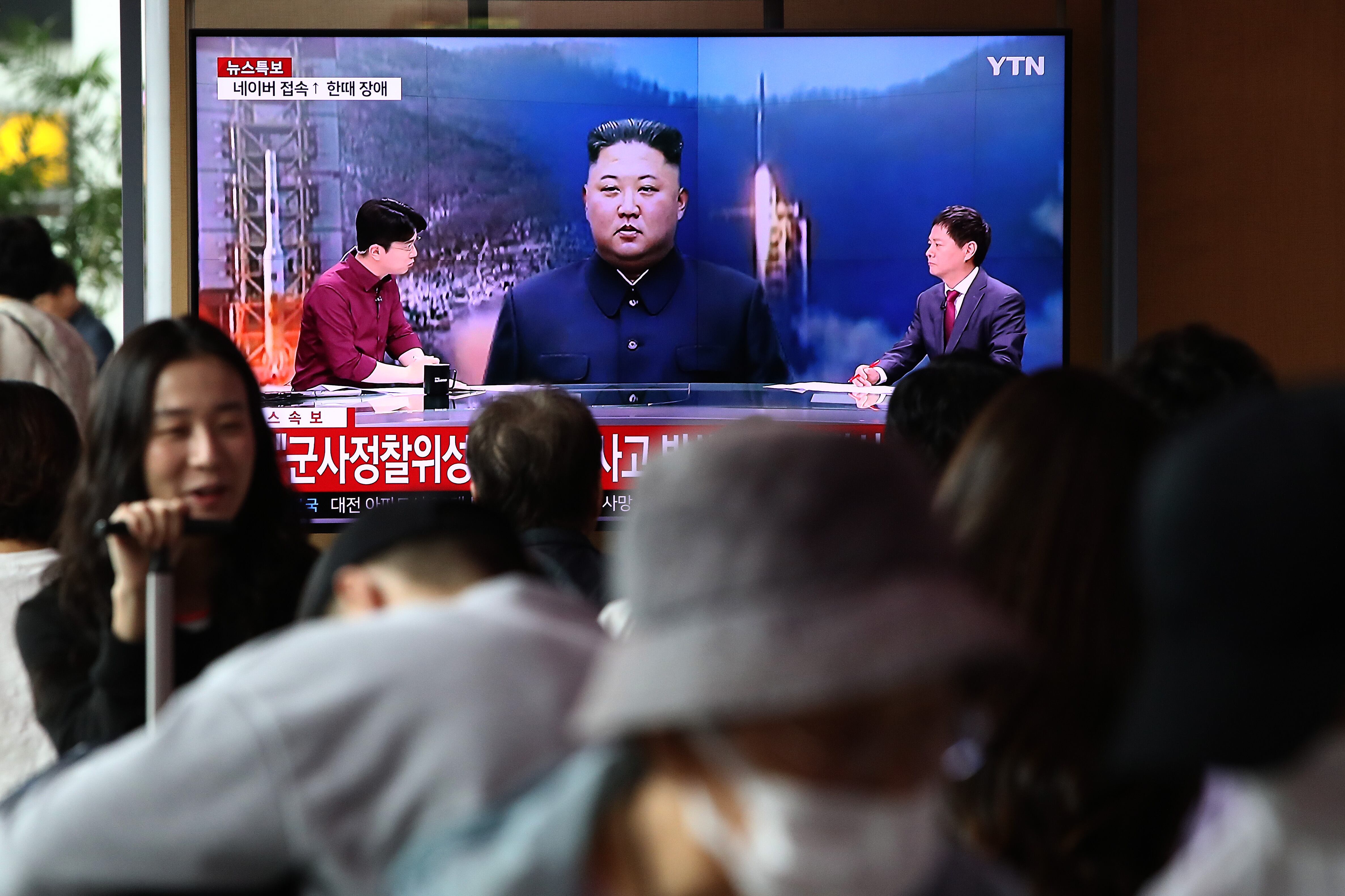 SEOUL, SOUTH KOREA - MAY 31: People watch a television broadcast showing a file image of a North Korean leader Kim Jong-Un at the Seoul Railway Station on May 31, 2023 in Seoul, South Korea. North Korea fired what it claims to be a "space launch vehicle" southward Wednesday, but it fell into the Yellow Sea after an "abnormal" flight, the South Korean military said, in a botched launch that defied international criticism and warnings. (Photo by Chung Sung-Jun/Getty Images)
