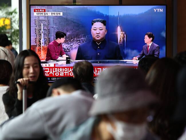 SEOUL, SOUTH KOREA - MAY 31: People watch a television broadcast showing a file image of a North Korean leader Kim Jong-Un at the Seoul Railway Station on May 31, 2023 in Seoul, South Korea. North Korea fired what it claims to be a "space launch vehicle" southward Wednesday, but it fell into the Yellow Sea after an "abnormal" flight, the South Korean military said, in a botched launch that defied international criticism and warnings. (Photo by Chung Sung-Jun/Getty Images)