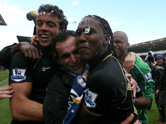 Wigan manager Roberto Martinez (centre) celebrates staying up with his players Hugo Rodallega (right) and Franco Di Santo during the Barclays Premier League match at Britannia Stadium, Stoke. (Photo by Dave Thompson/PA Images via Getty Images)