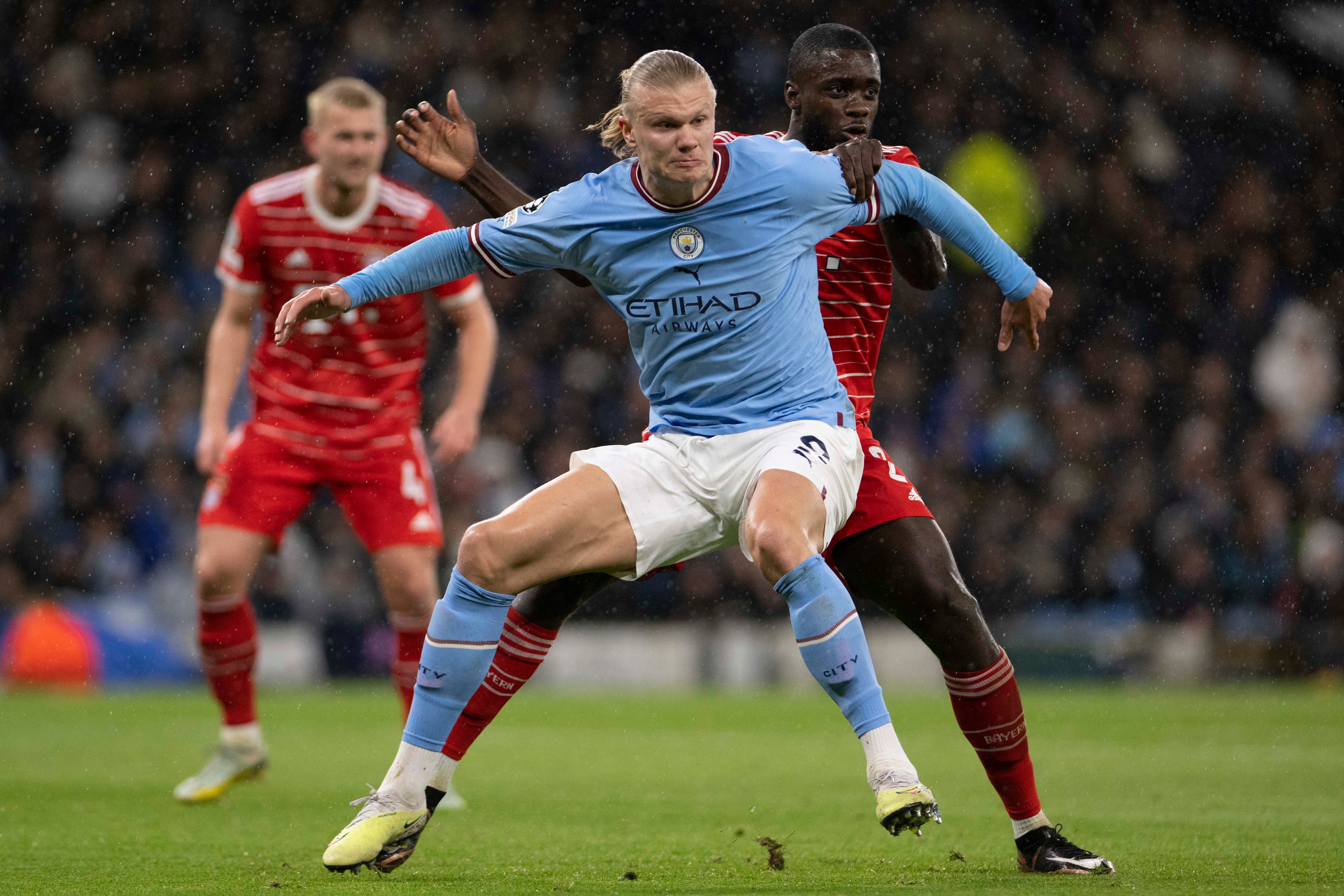 MANCHESTER, ENGLAND - APRIL 11: Dayot Upamecano of Bayern Munich and Erling Haaland of Manchester City battle for the ball during the UEFA Champions League quarterfinal first leg match between Manchester City and FC Bayern München at Etihad Stadium on April 11, 2023 in Manchester, England. (Photo by Richard Callis ATPImages/Getty Images)