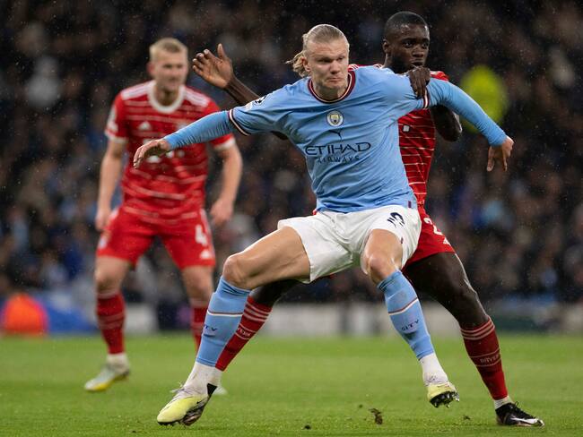 MANCHESTER, ENGLAND - APRIL 11: Dayot Upamecano of Bayern Munich and Erling Haaland of Manchester City battle for the ball during the UEFA Champions League quarterfinal first leg match between Manchester City and FC Bayern München at Etihad Stadium on April 11, 2023 in Manchester, England. (Photo by Richard Callis ATPImages/Getty Images)