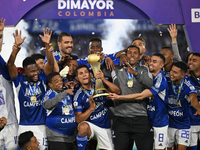 Millonarios' players celebrate with the trophy after defeating Atletico Nacional during the Colombian First Division Football Championship final match at the El Campin stadium in Bogota on June 24, 2023. (Photo by Raul ARBOLEDA / AFP) (Photo by RAUL ARBOLEDA/AFP via Getty Images)