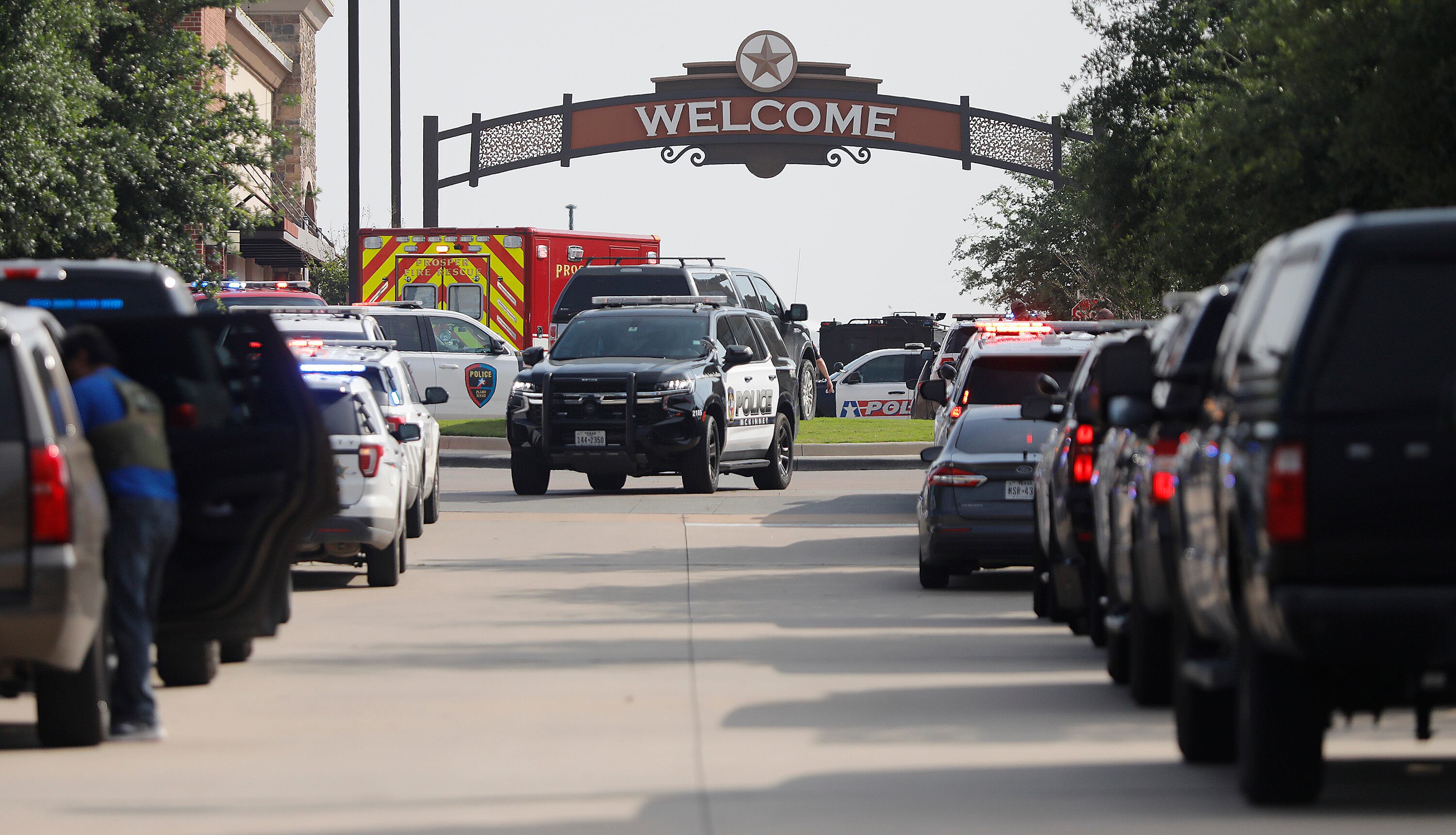 ALLEN, TEXAS - MAY 6: Emergency vehicles line the entrance to the Allen Premium Outlets where a shooting took place on May 6, 2023 in Allen, Texas. According to reports, a shooter opened fire at the outlet mall, injuring at least nine people who were taken to local hospitals. The police have confirmed there were fatalities but have not specified how many. The unidentified shooter was neutralized by an Allen Police officer responding to an unrelated call. (Photo by Stewart  F. House/Getty Images)