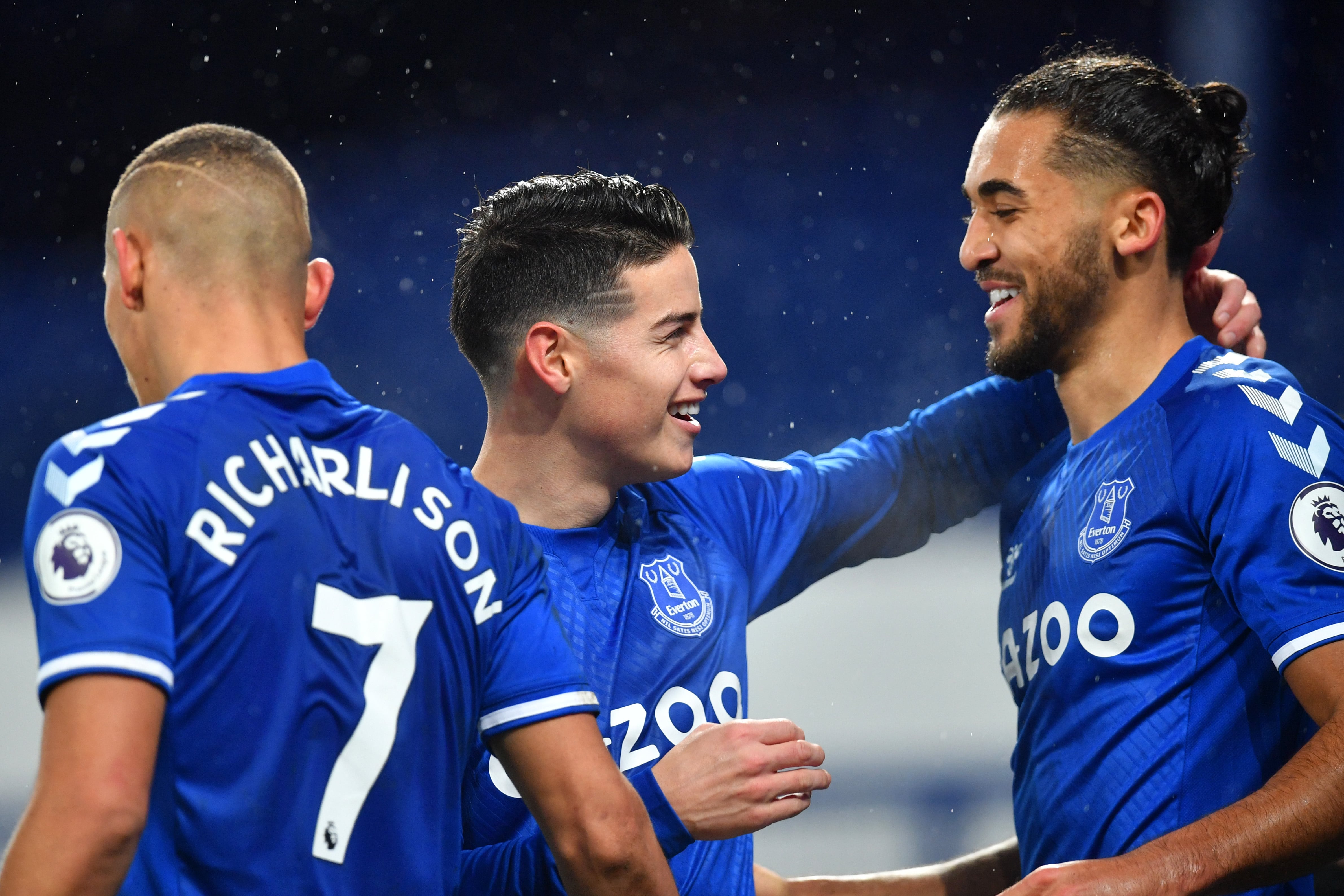 LIVERPOOL, ENGLAND - JANUARY 27: James Rodriguez of Everton celebrates with team mate Dominic Calvert-Lewin (R) after scoring their side's first goal during the Premier League match between Everton and Leicester City at Goodison Park on January 27, 2021 in Liverpool, England. Sporting stadiums around the UK remain under strict restrictions due to the Coronavirus Pandemic as Government social distancing laws prohibit fans inside venues resulting in games being played behind closed doors. (Photo by Paul Ellis - Pool/Getty Images)