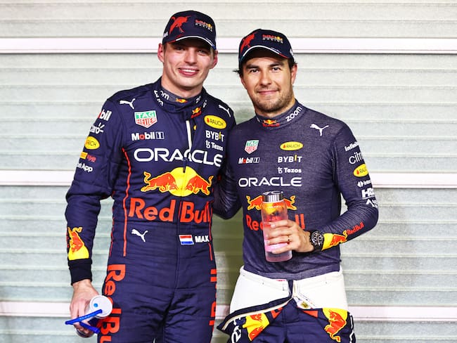 ABU DHABI, UNITED ARAB EMIRATES - NOVEMBER 19: Pole position qualifier Max Verstappen of the Netherlands and Oracle Red Bull Racing and Second placed qualifier Sergio Perez of Mexico and Oracle Red Bull Racing pose for a photo in parc ferme during qualifying ahead of the F1 Grand Prix of Abu Dhabi at Yas Marina Circuit on November 19, 2022 in Abu Dhabi, United Arab Emirates. (Photo by Mark Thompson/Getty Images)
