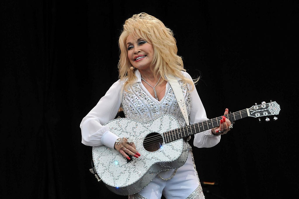 GLASTONBURY, ENGLAND - JUNE 29: Dolly Parton performs on the Pyramid stage during day three of the Glastonbury Festival at Worthy Farm in Pilton on June 29, 2014 in Glastonbury, England. (Photo by Jim Dyson/Getty Images)