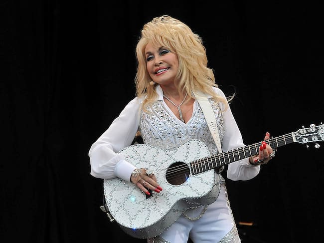 GLASTONBURY, ENGLAND - JUNE 29: Dolly Parton performs on the Pyramid stage during day three of the Glastonbury Festival at Worthy Farm in Pilton on June 29, 2014 in Glastonbury, England. (Photo by Jim Dyson/Getty Images)