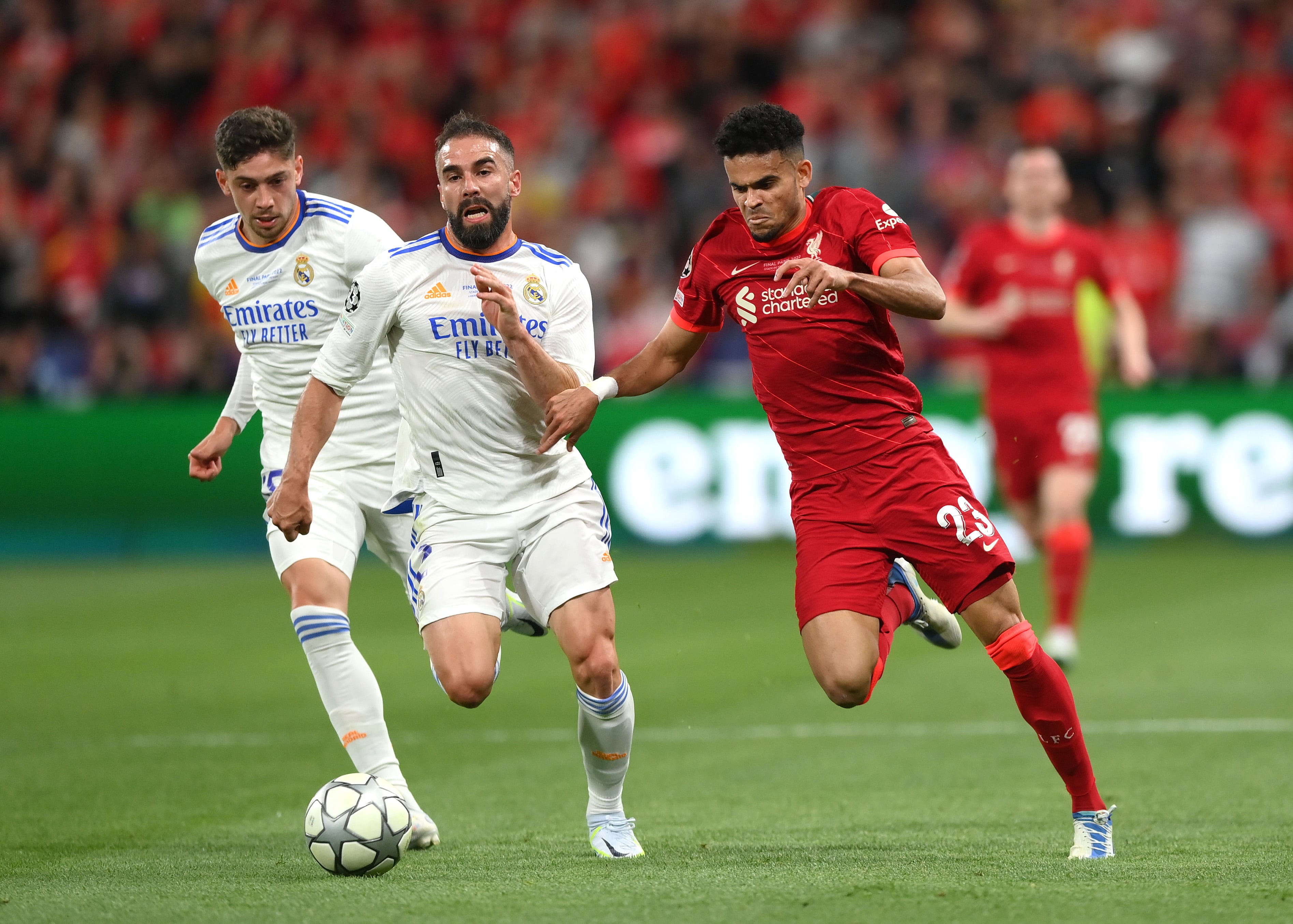 PARIS, FRANCE - MAY 28:  Luis Diaz of Liverpool is challenged by  Daniel Carvajal of Real Madrid as Federico Valverde looks on during the UEFA Champions League final match between Liverpool FC and Real Madrid at Stade de France on May 28, 2022 in Paris, France. (Photo by Shaun Botterill/Getty Images)