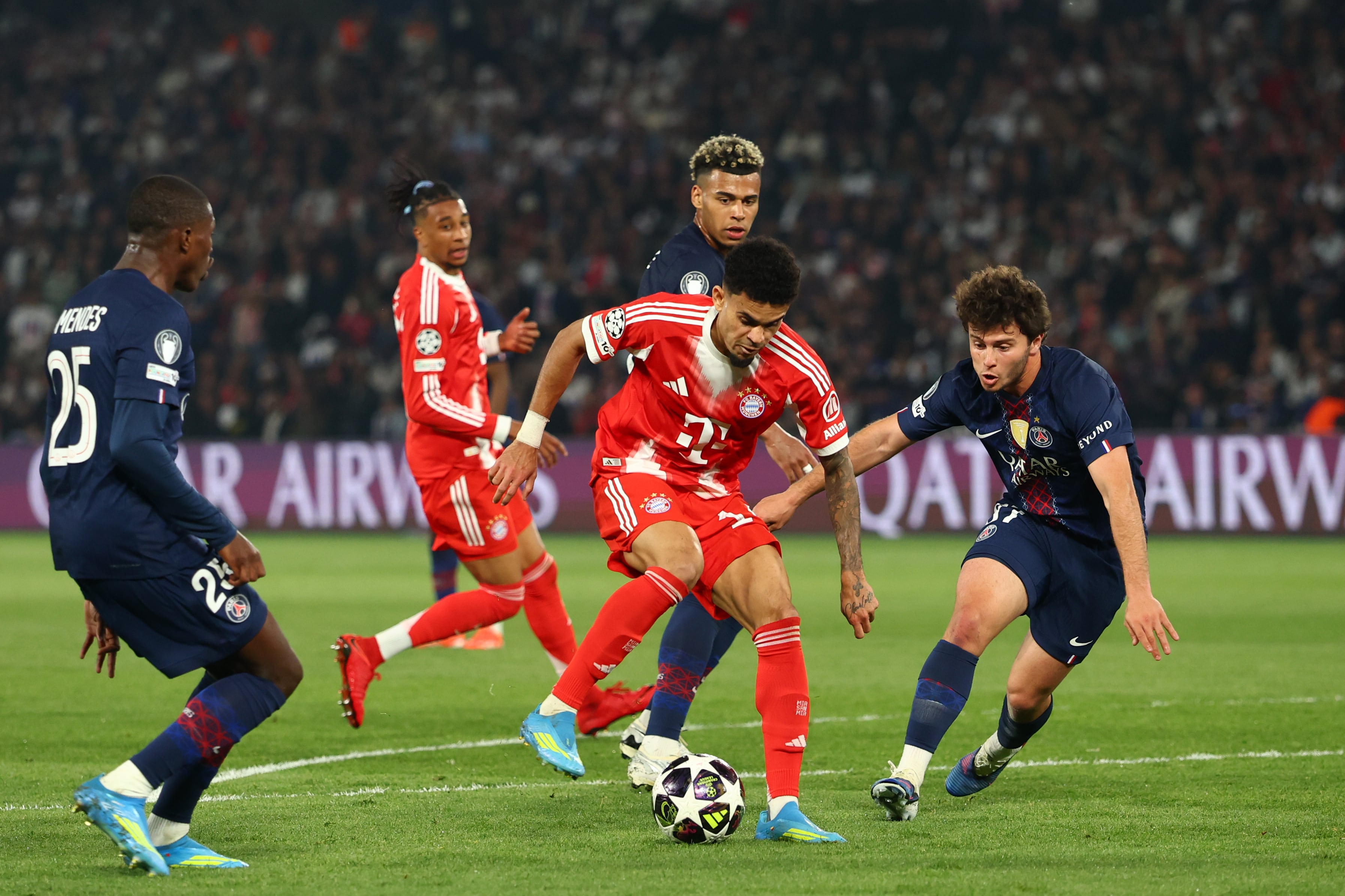 PARIS, FRANCE - APRIL 28:    Luis Diaz of Bayern Munich competes with Joao Neves of Paris Saint-Germain during the UEFA Champions League 2025/26 Semi Final First Leg match between Paris Saint-Germain and Bayern Munich at Parc des Princes on April 28, 2026 in Paris, France. (Photo by Chris Brunskill/Fantasista/Getty Images)