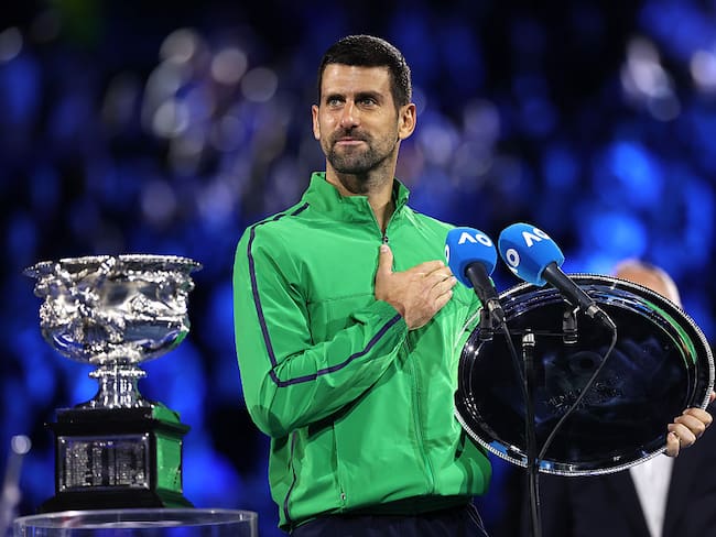 MELBOURNE, AUSTRALIA - FEBRUARY 01: Runner-up Novak Djokovic of Serbia speaks with the finalist plaque at the presentation ceremony after the Men's Singles Final against Carlos Alcaraz of Spain during day 15 of the 2026 Australian Open at Melbourne Park on February 01, 2026 in Melbourne, Australia. (Photo by Phil Walter/Getty Images)
