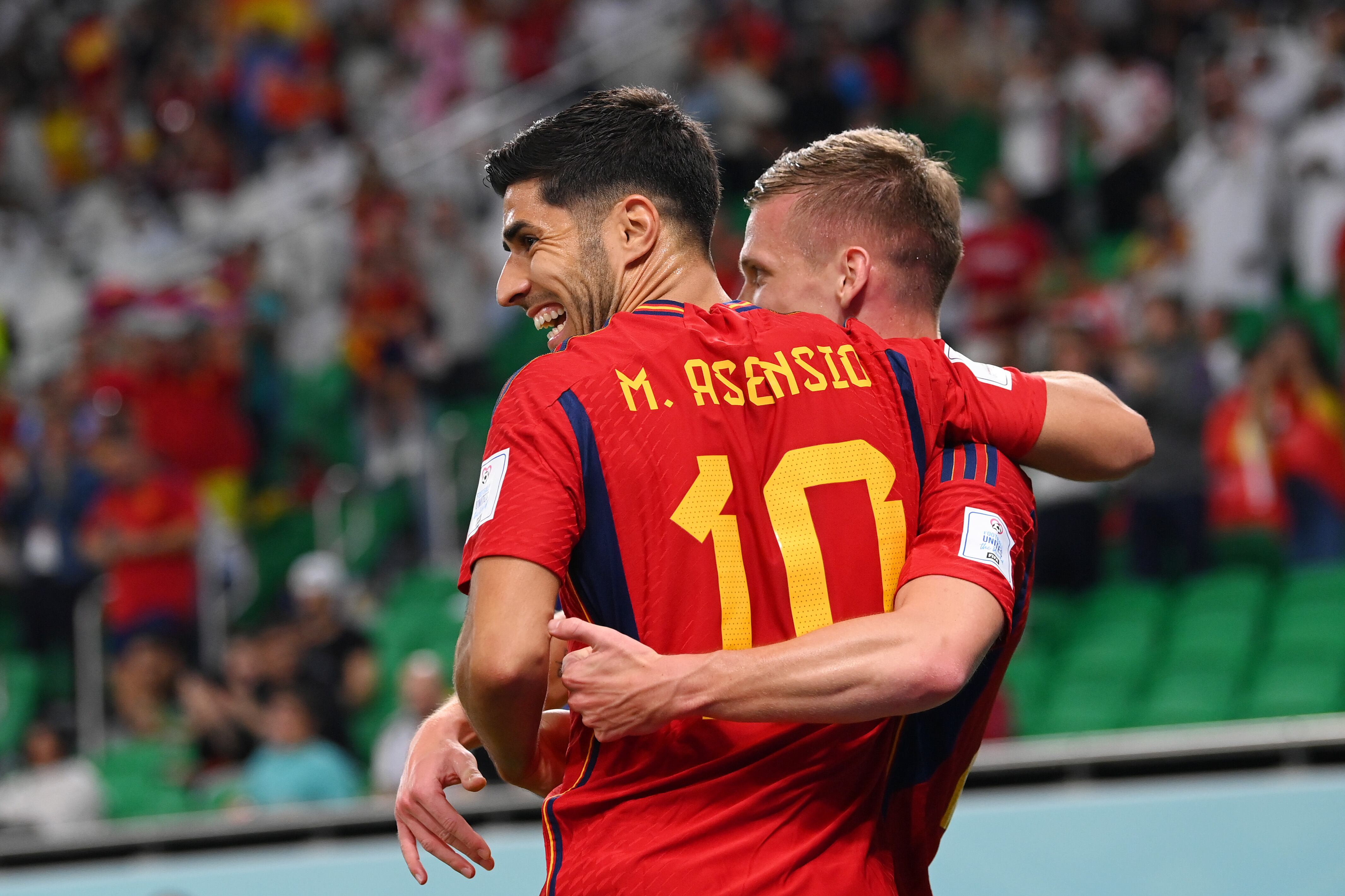 DOHA, QATAR - NOVEMBER 23: Marco Asensio of Spain celebrates with their teammate Jordi Alba after scoring their team's second goal  during the FIFA World Cup Qatar 2022 Group E match between Spain and Costa Rica at Al Thumama Stadium on November 23, 2022 in Doha, Qatar. (Photo by Stu Forster/Getty Images)