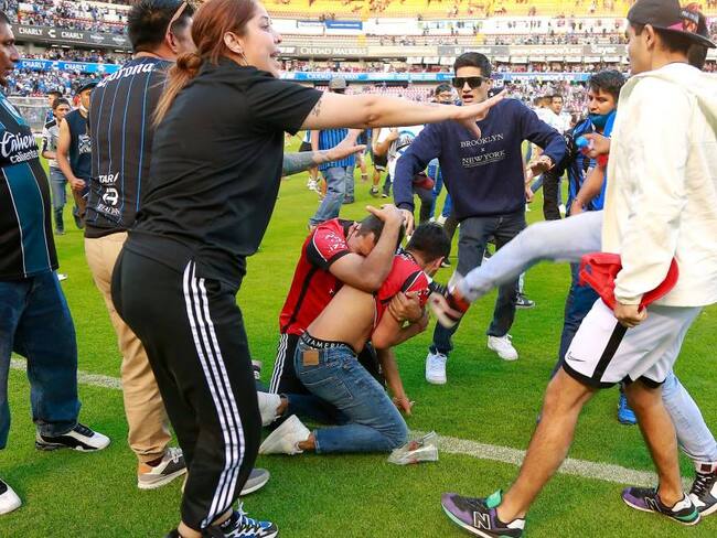 Pelea en el estadio Corregidora de México. Foto: Getty