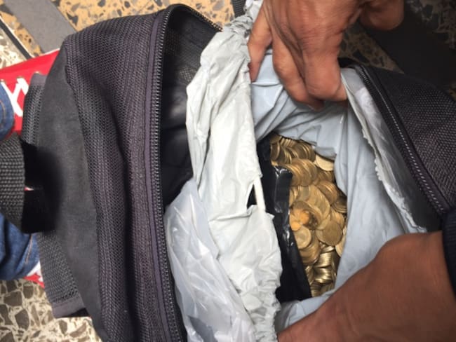 Vendedor recibe un millón de pesos en monedas tras ganar una demanda