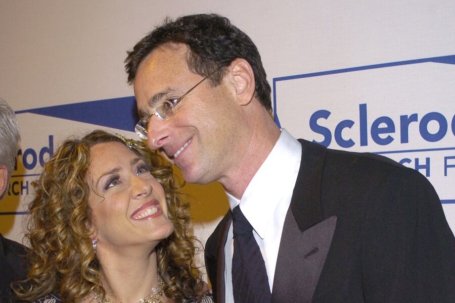 Joely Fisher and Bob Saget during 13th Annual "Cool Comedy  Hot Cuisine" Benefit for Scleroderma Research - Arrivals at Regent Beverly Wilshire Hotel in Beverly Hills, California, United States. (Photo by L. Cohen/WireImage for Scleroderma Research Foundation)