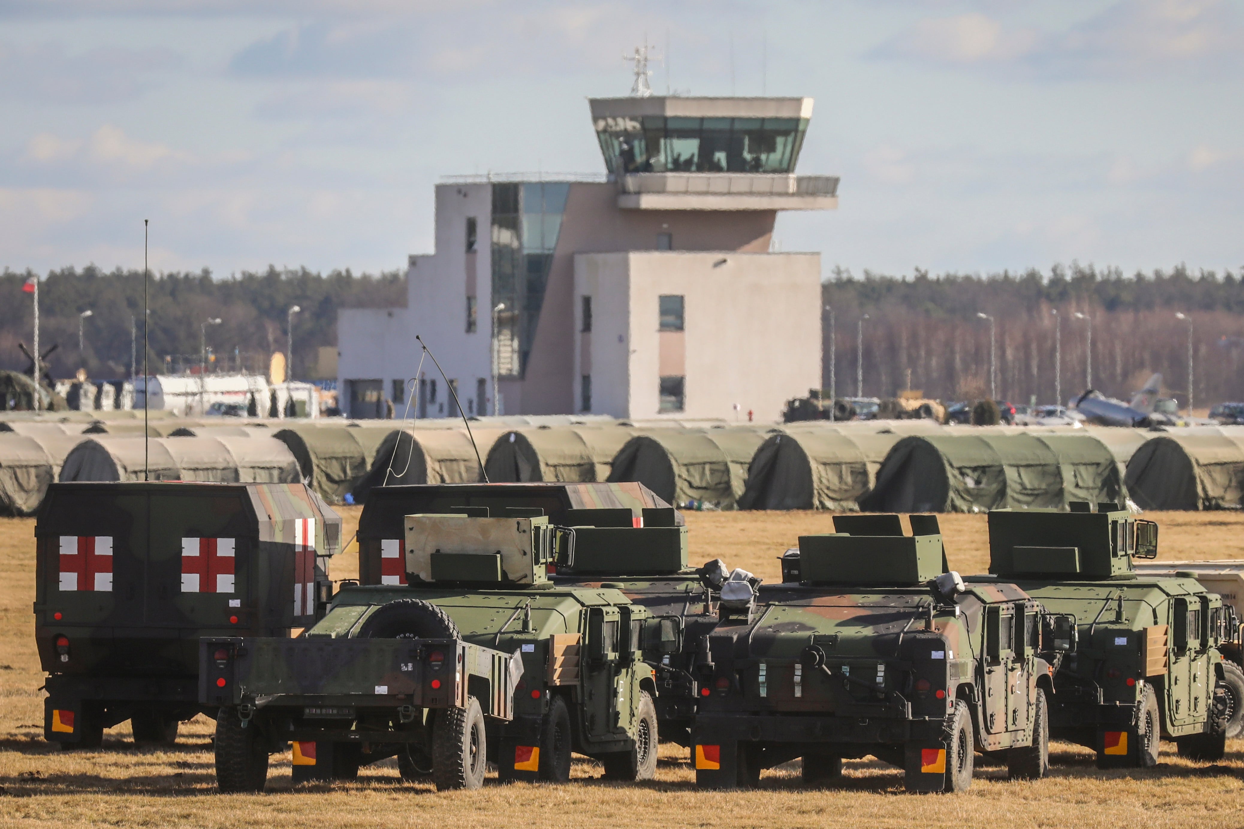 Military vehicles are seen at the military base for U.S. troops which being established at the Mielec Airport. Mielec, Poland on February 12, 2022. U.S. troops have arrived as reinforcements for its various NATO allies in Eastern Europe, including Poland, as fears grow of a possible Russian invasion of Ukraine (Photo by Beata Zawrzel/NurPhoto via Getty Images)