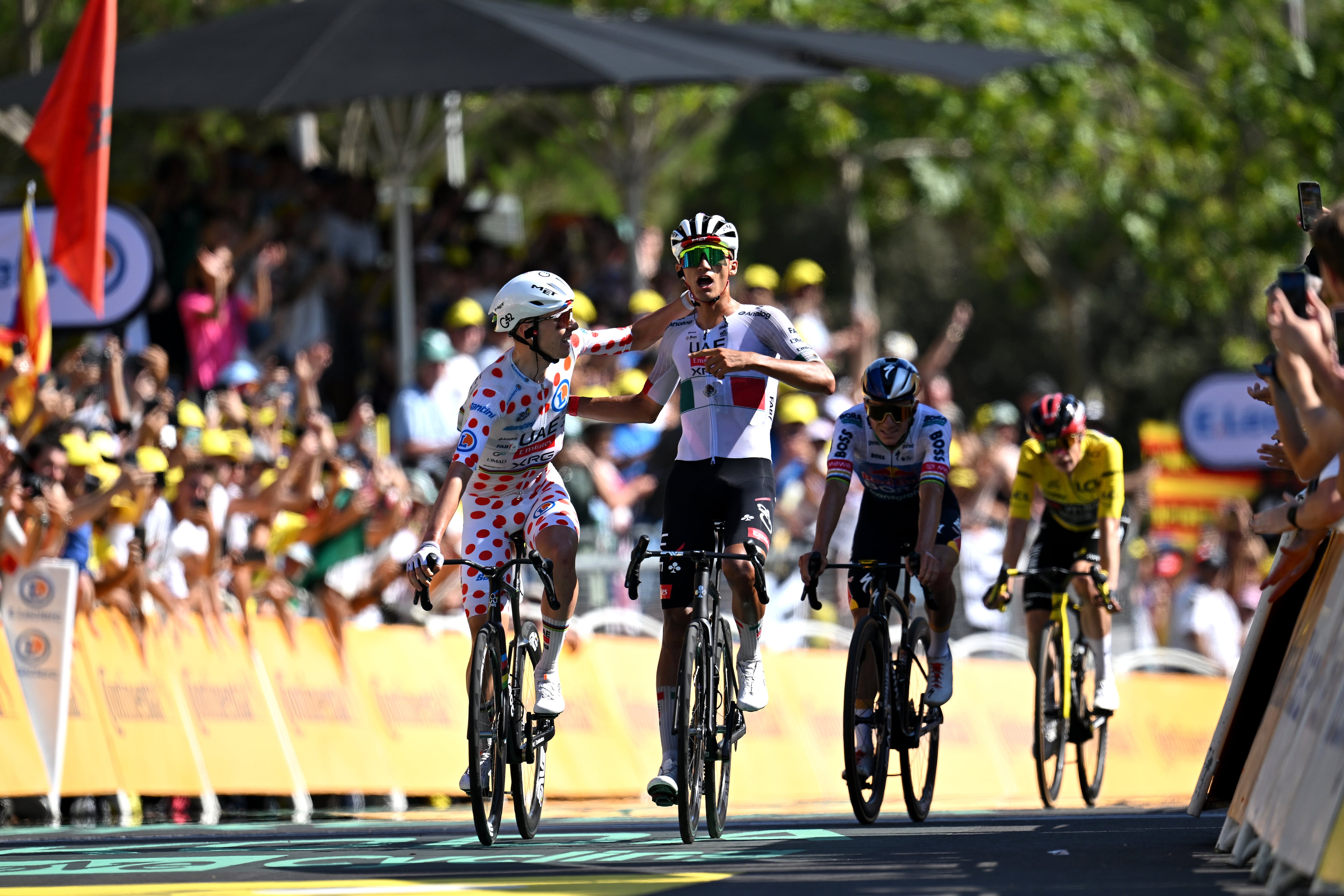 BARCELONA, SPAIN - JULY 05: (L-R) Tadej Pogacar of Slovenia - Polka dot Mountain Jersey and stage winner Isaac Del Toro of Mexico and UAE Team Emirates - XRG celebrate at finish line during the 113th Tour de France 2026, Stage 2 a 168.5km stage from Tarragona to Barcelona 109m / #UCIWT / on July 05, 2026 in Barcelona, Spain. (Photo by Tim de Waele/Getty Images)