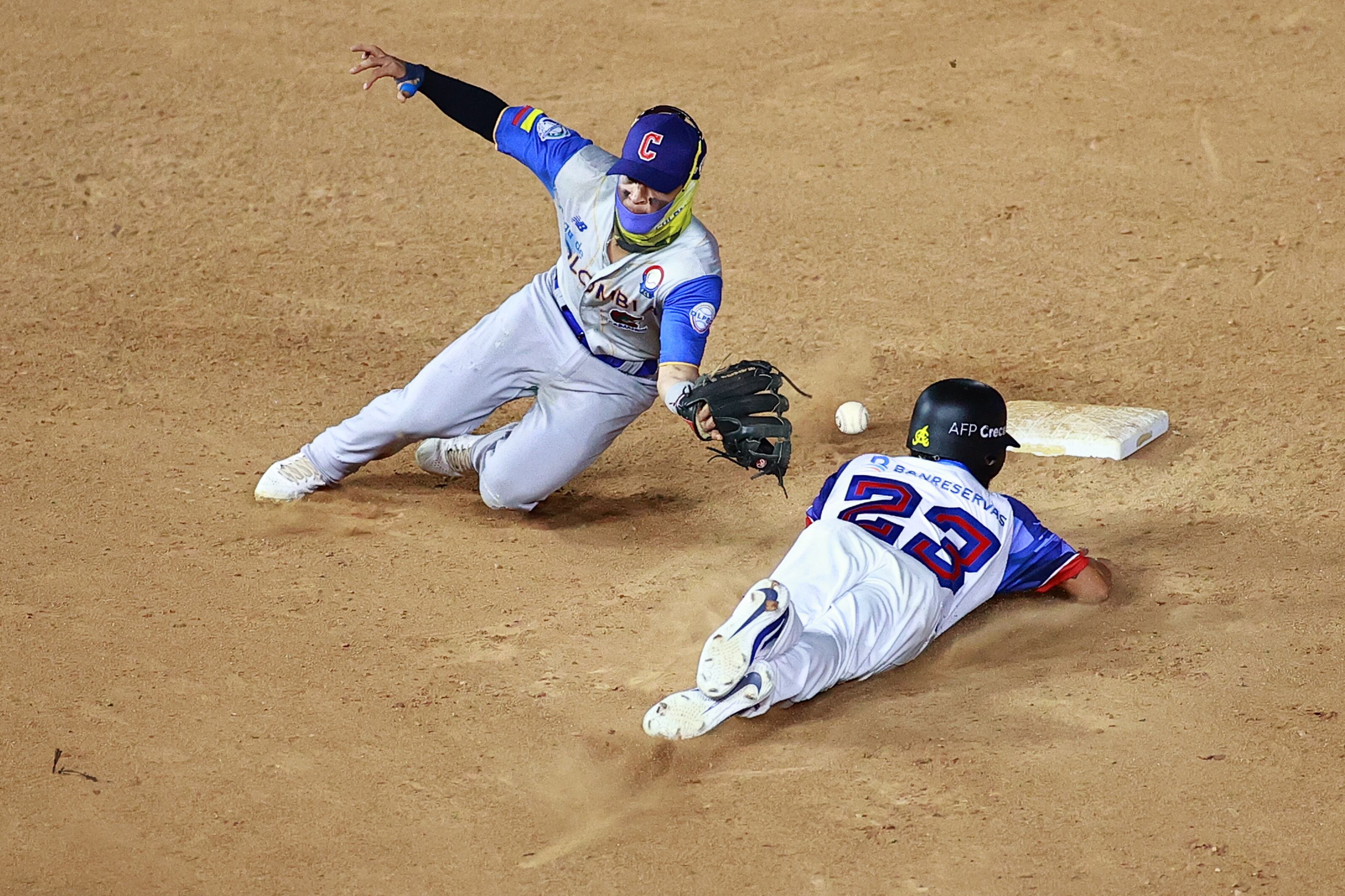 MAZATLAN, MEXICO - FEBRUARY 04: Yefri Perez #23 of Águilas Cibaeñas of Dominican Republic slides safely into second base against Francisco Acuna #10 of Caimanes de Barranquilla of Colombia in the 8th inning during the game between Colombia and Dominican Republic as part of Serie del Caribe 2021 at Teodoro Mariscal Stadium on February 04, 2021 in Mazatlan, Mexico. (Photo by Hector Vivas/Getty Images)