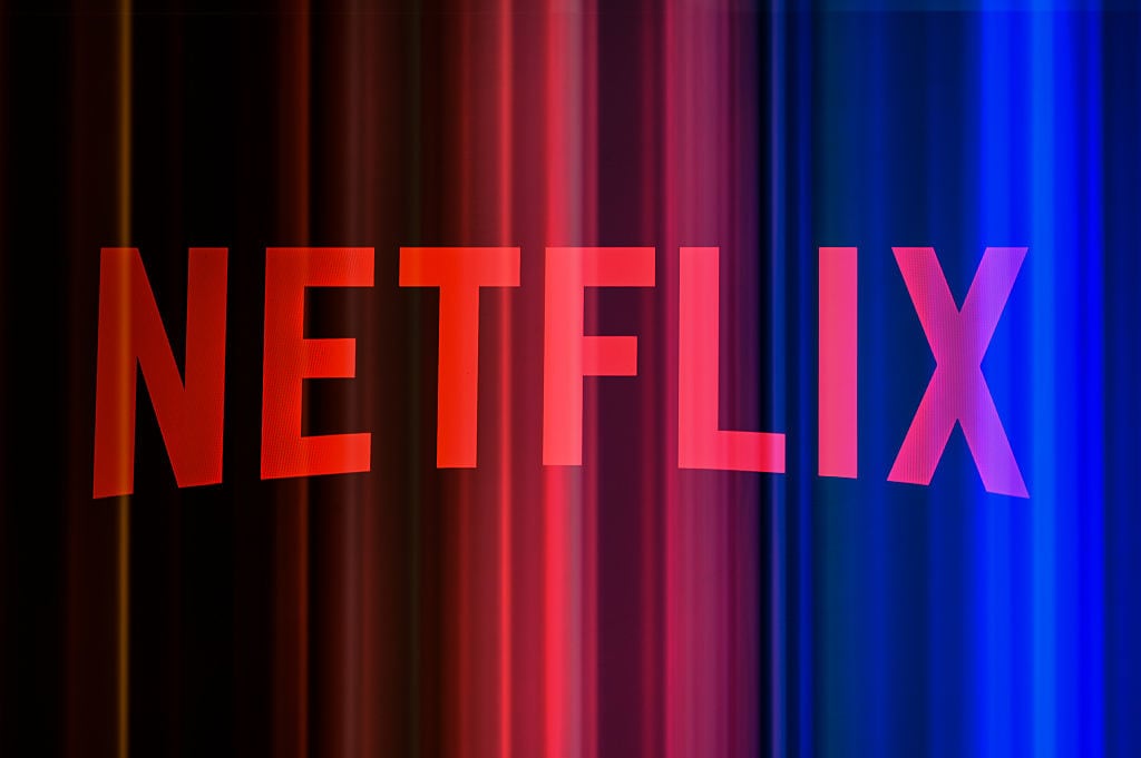 The Netflix logo is photographed using a double exposure with a promotional image featuring a color gradient in the background, in Creteil, France, on July 16, 2026, as Netflix released its financial results for the second quarter of 2026. (Photo by Samuel Boivin/NurPhoto via Getty Images)